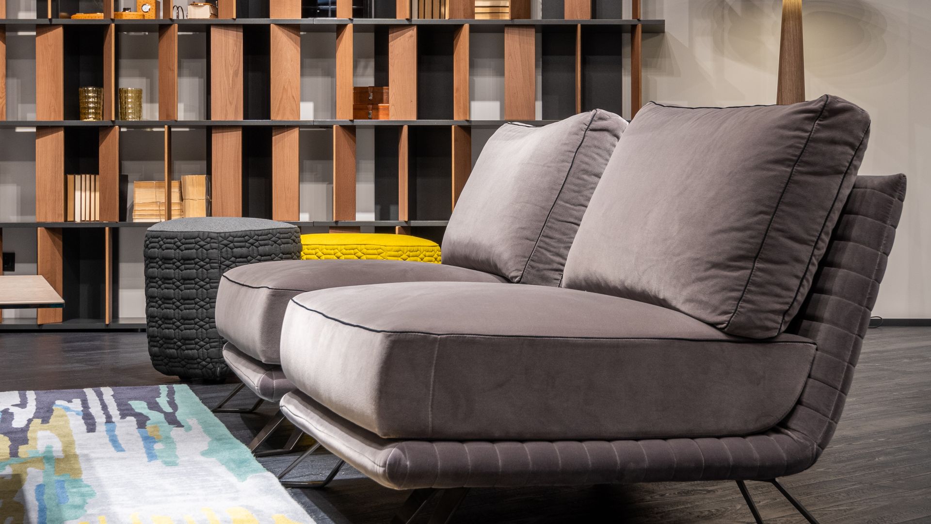 Modern living room with a settee, cushions and poufs