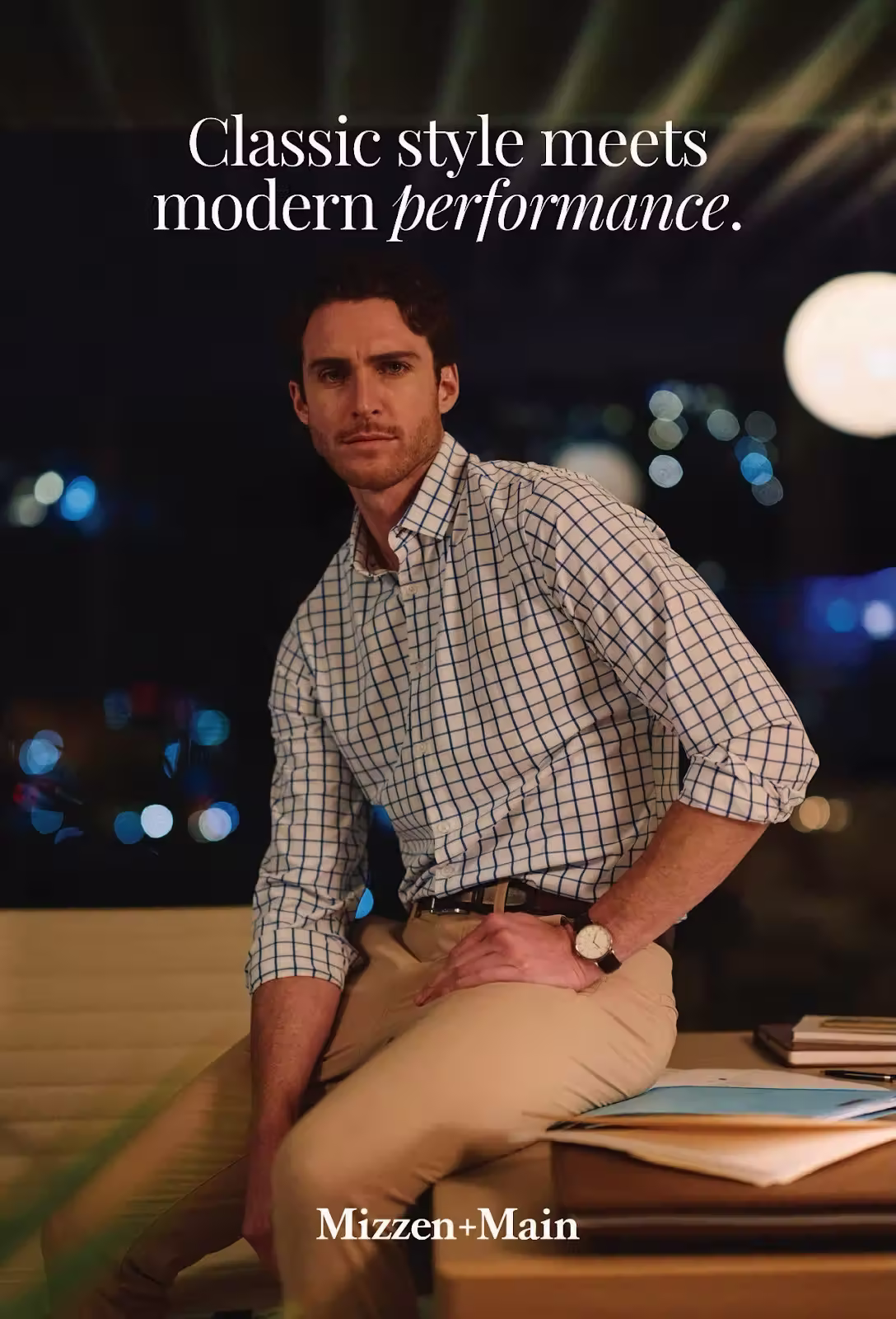 Mizzen+Main postcard showing a folded blue button-down shirt alongside a lifestyle image of a model wearing a checkered dress shirt, highlighting classic office style.
