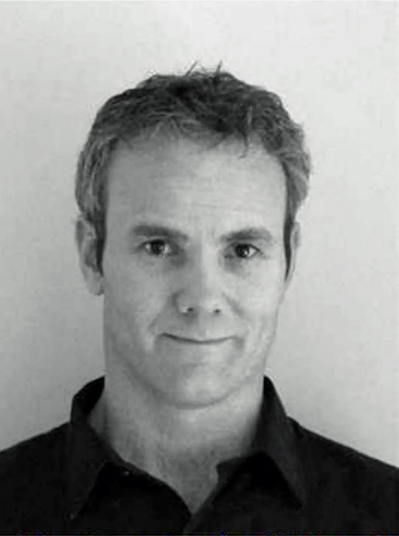 A black and white photo of Ian Mcleod