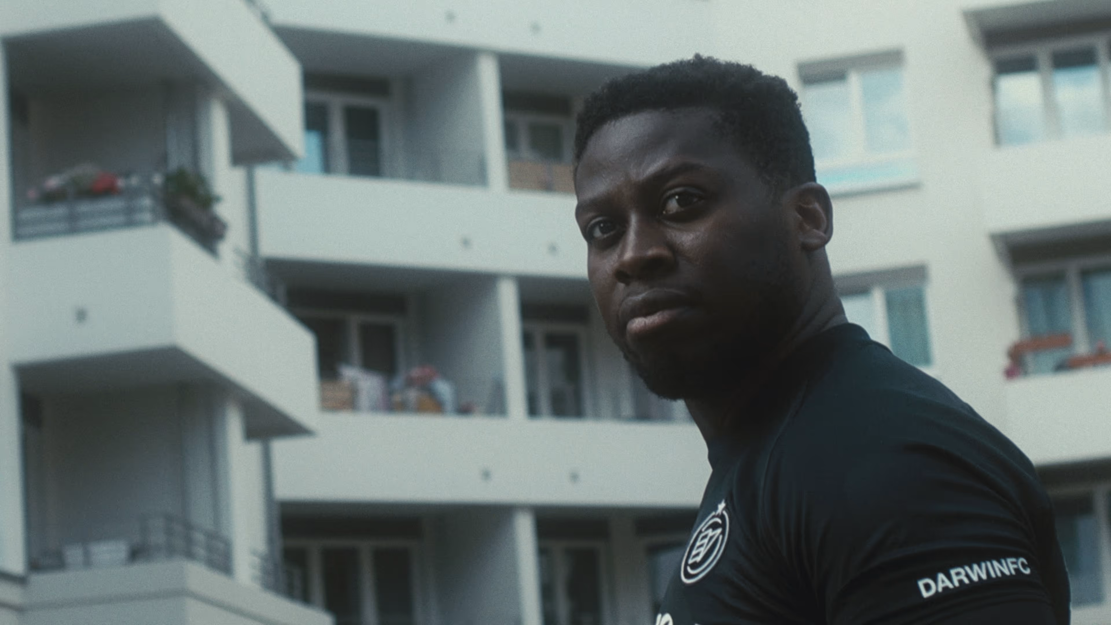 A Berlin football coach stands in the middle of his neighbourhood.