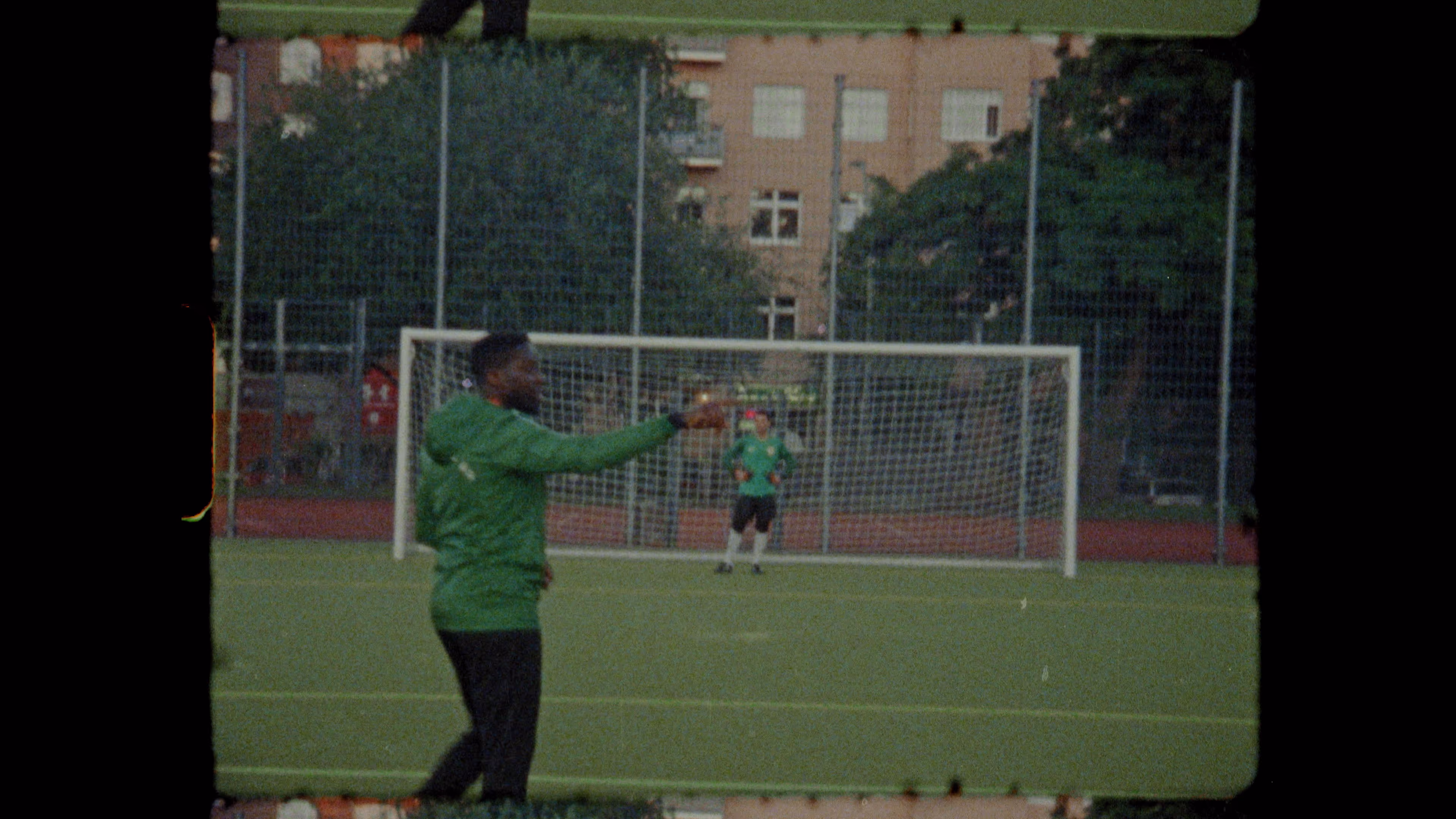 A football coach teaches the players the next exercise.