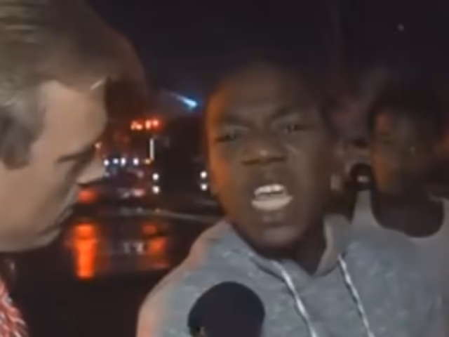 A young man gives an energetic interview.
