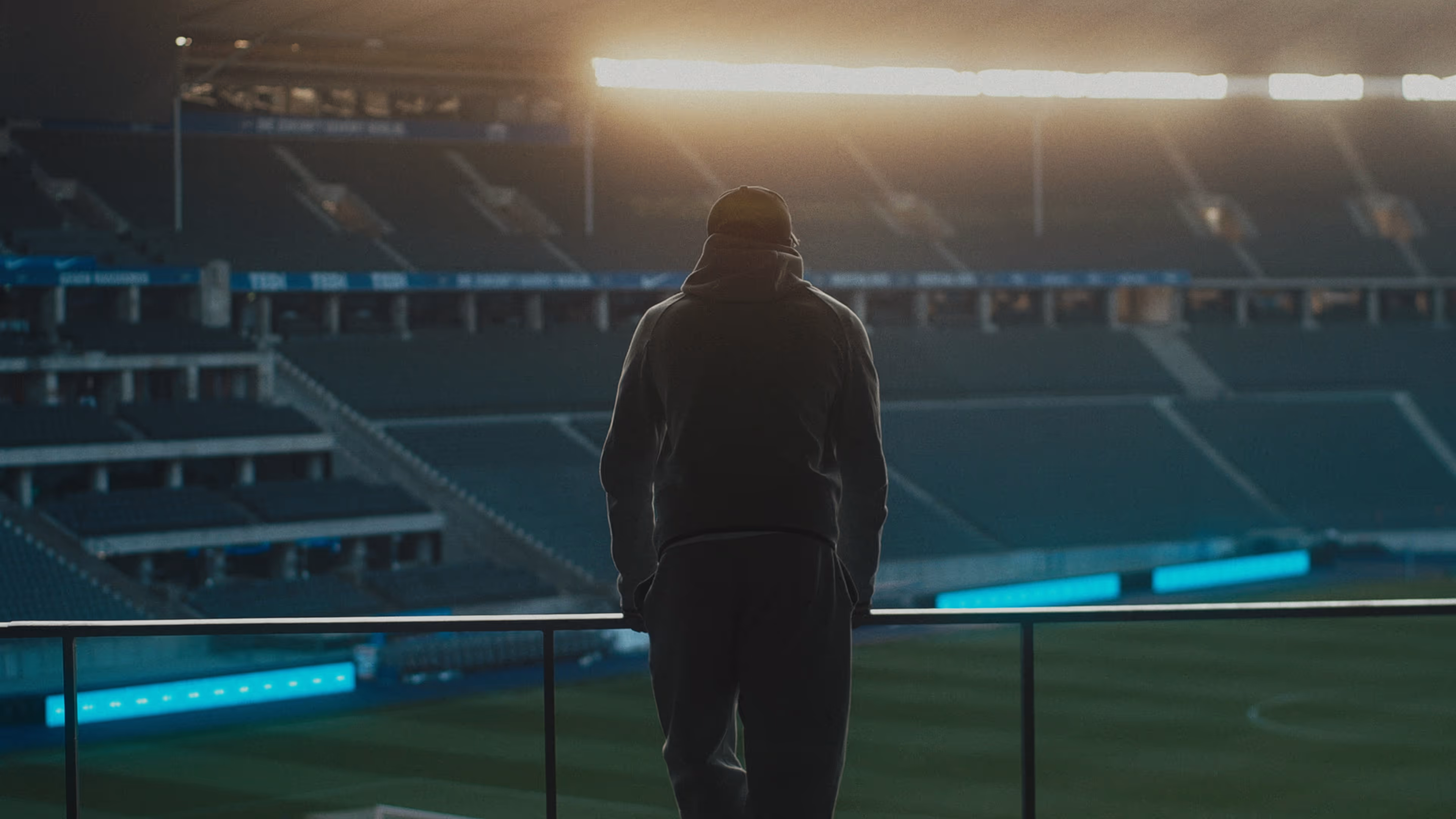 Jessic Ngankam leans against the stands inside the Berlin Olympiastadion.