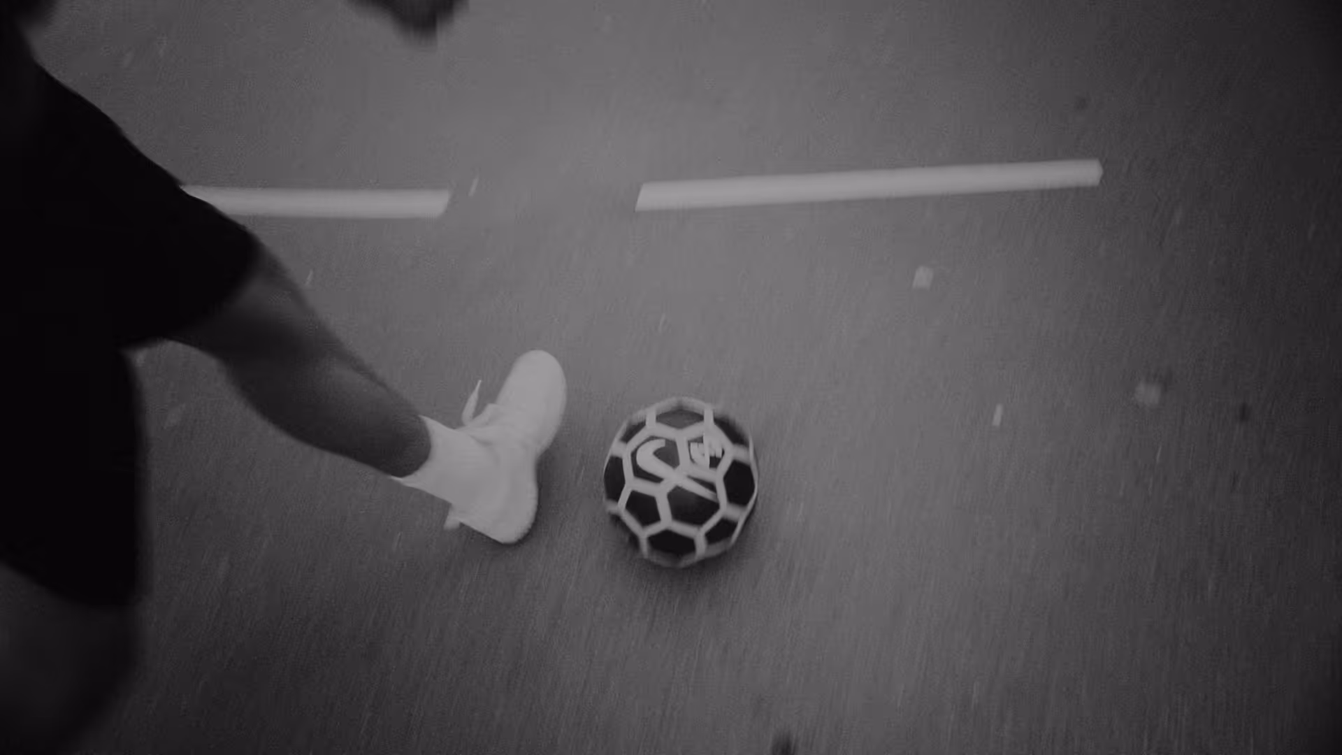 A football player is about to strike against a ball.