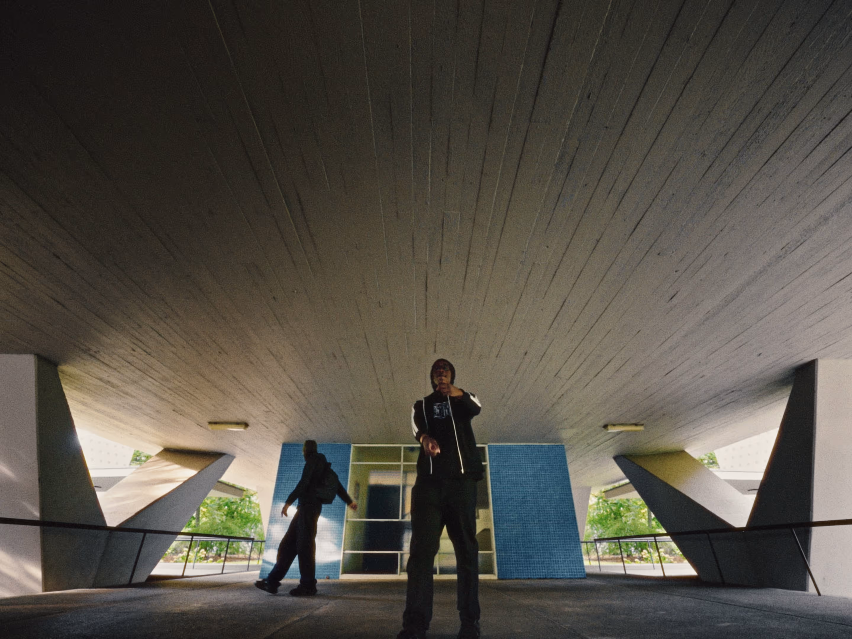Rapper Ash is inside the Interbau apartment block - designed by architect Oscar Niemeyer.