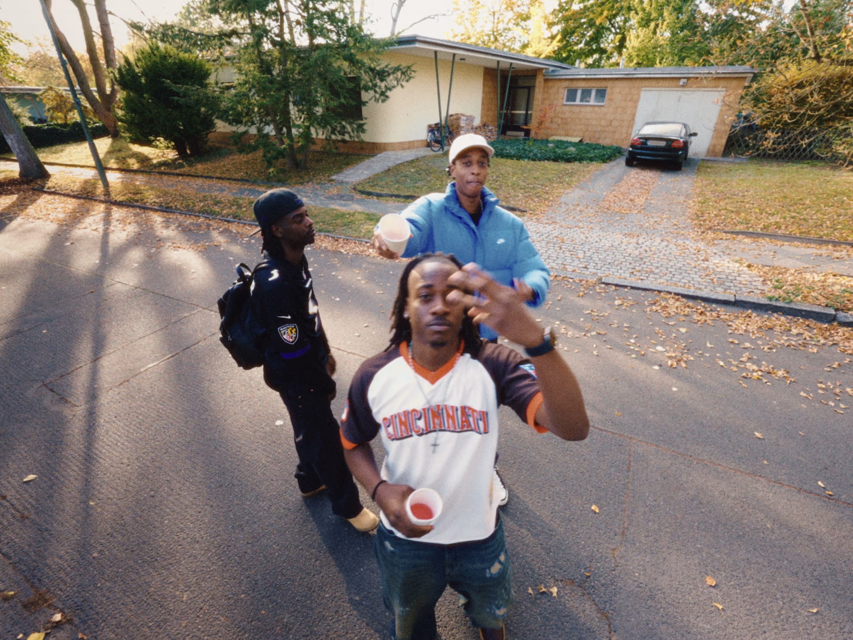 Rapper Ash and two of his friends perform his song "Europe" in Berlin Zehlendorf.