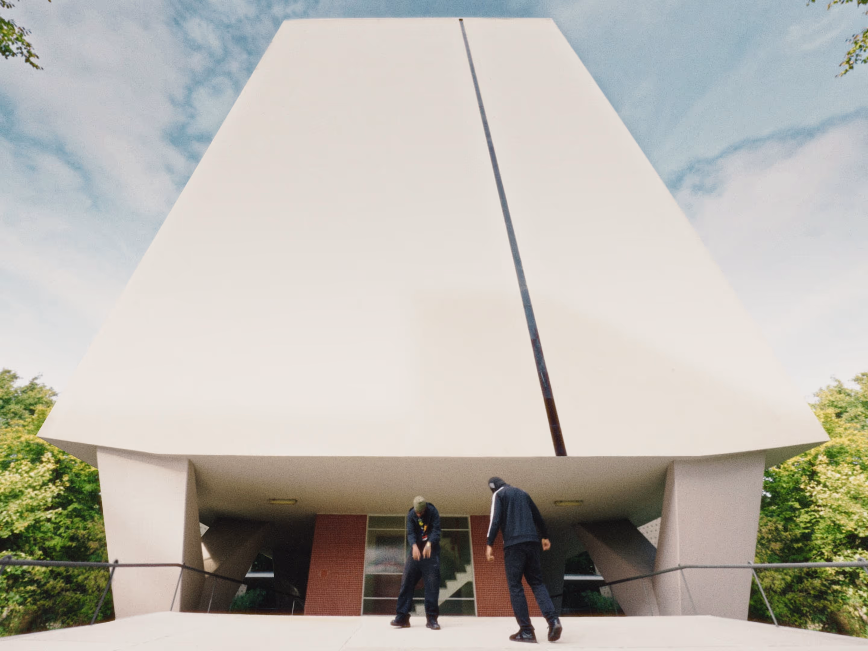 Rapper Ash and a friend are rapping in front of the iconic Interbau 1957 apartment block in Hansaviertel, Berlin.