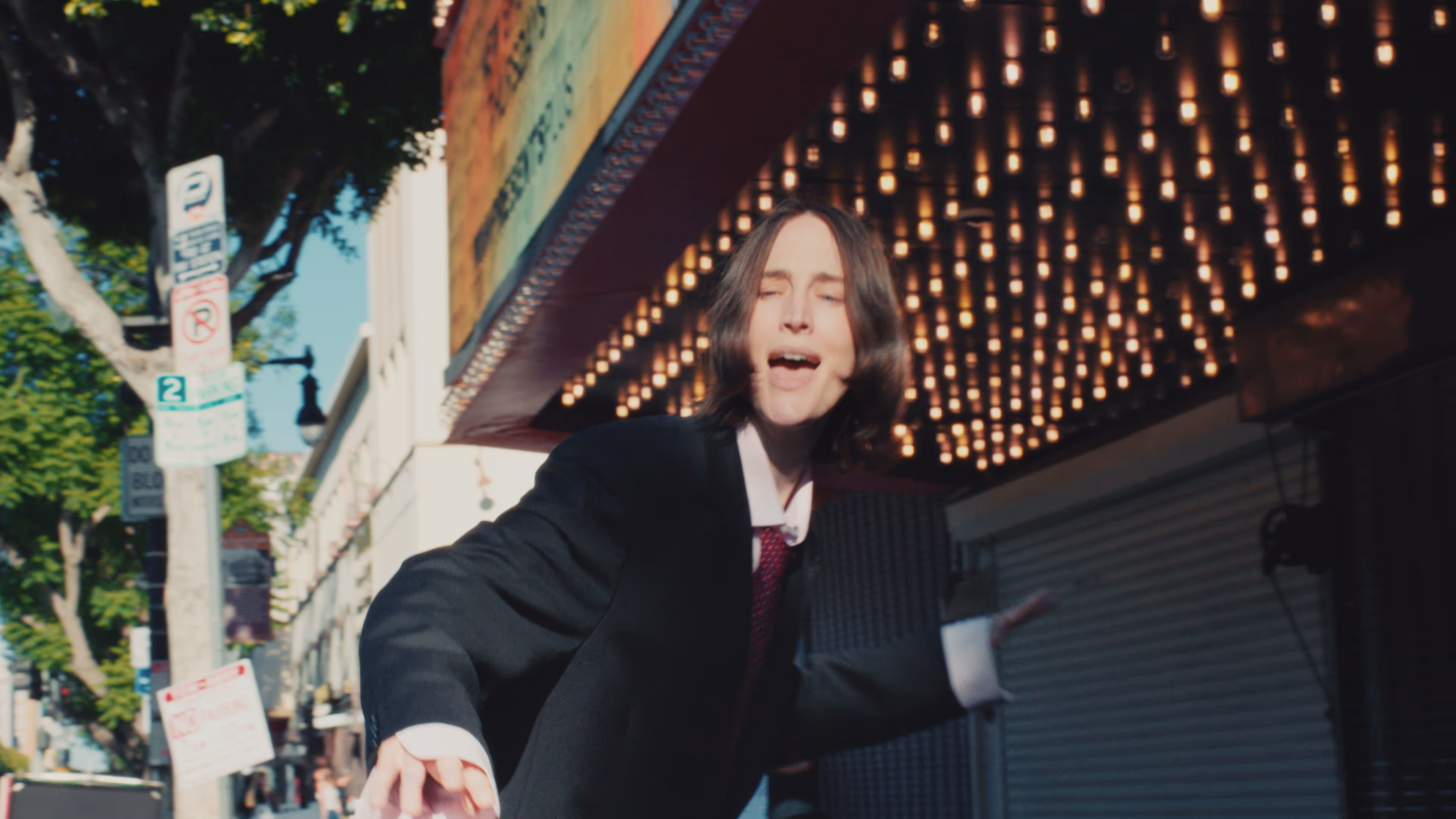 A shot of an actress performing on Hollywood Boulevard.