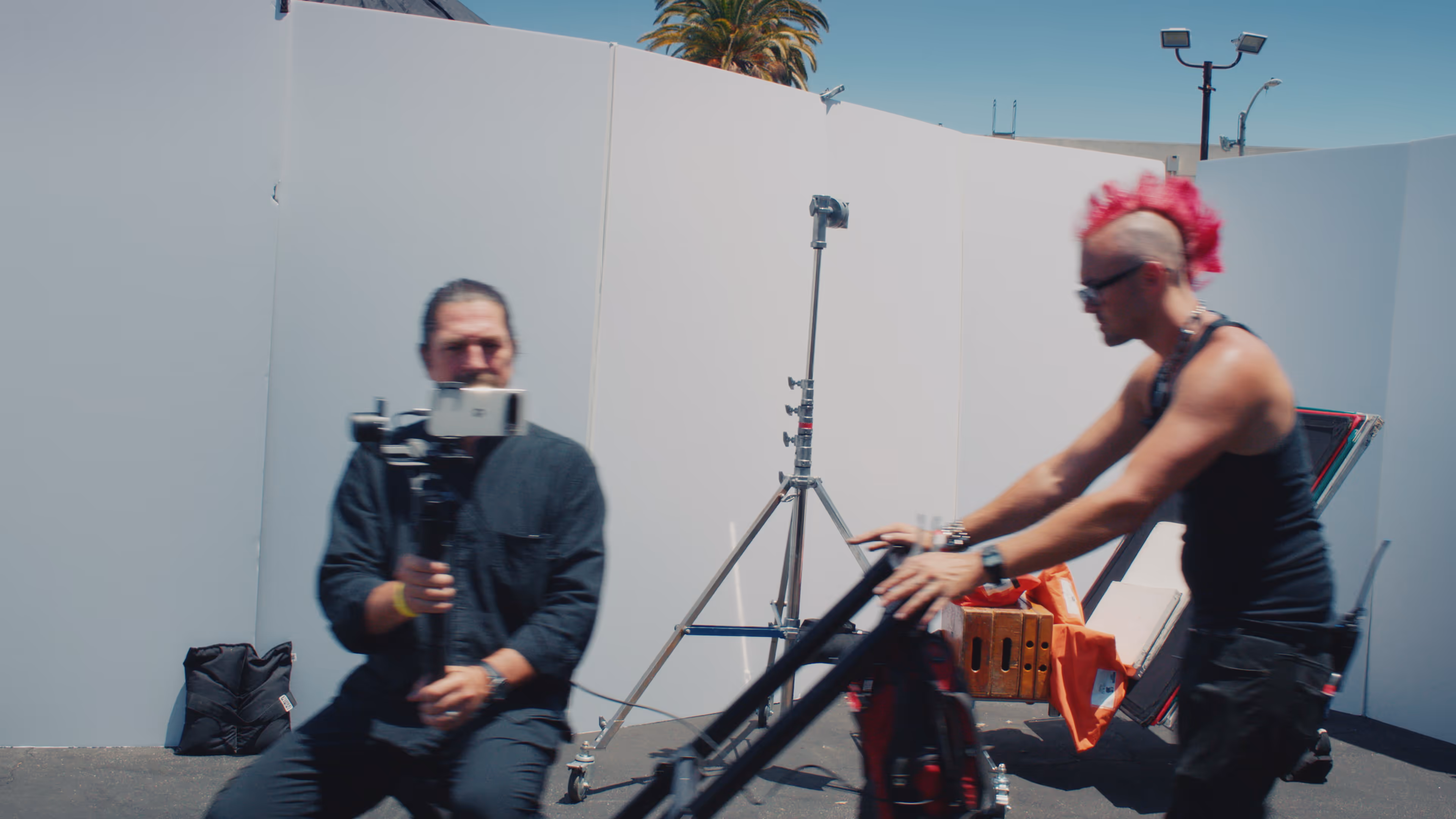 A DOP sits on a dolly while he's shooting with the Google Pixel.