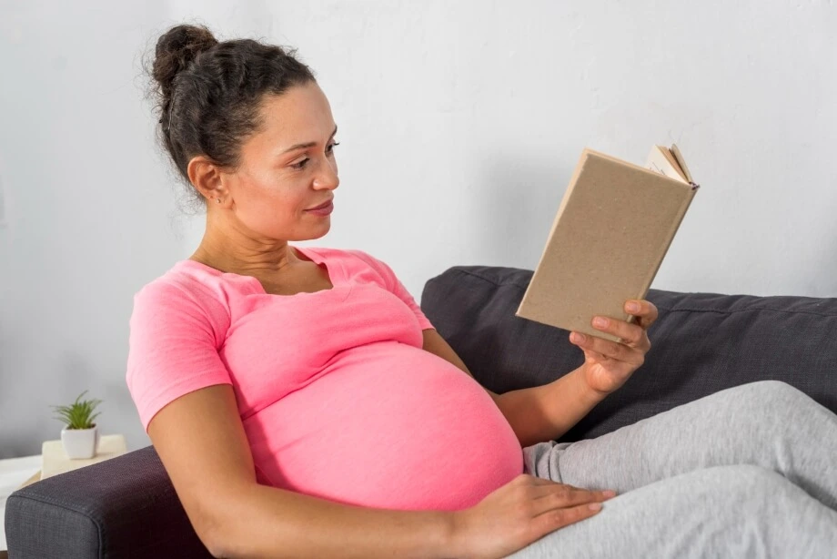 Pregnant women reading book