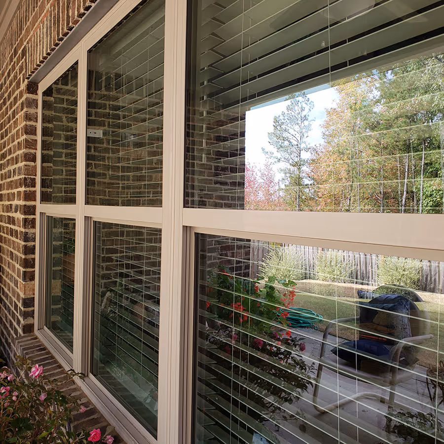 Residential windows that have been cleaned in Birmingham. The glass panes and window frames are showing streak-free results.