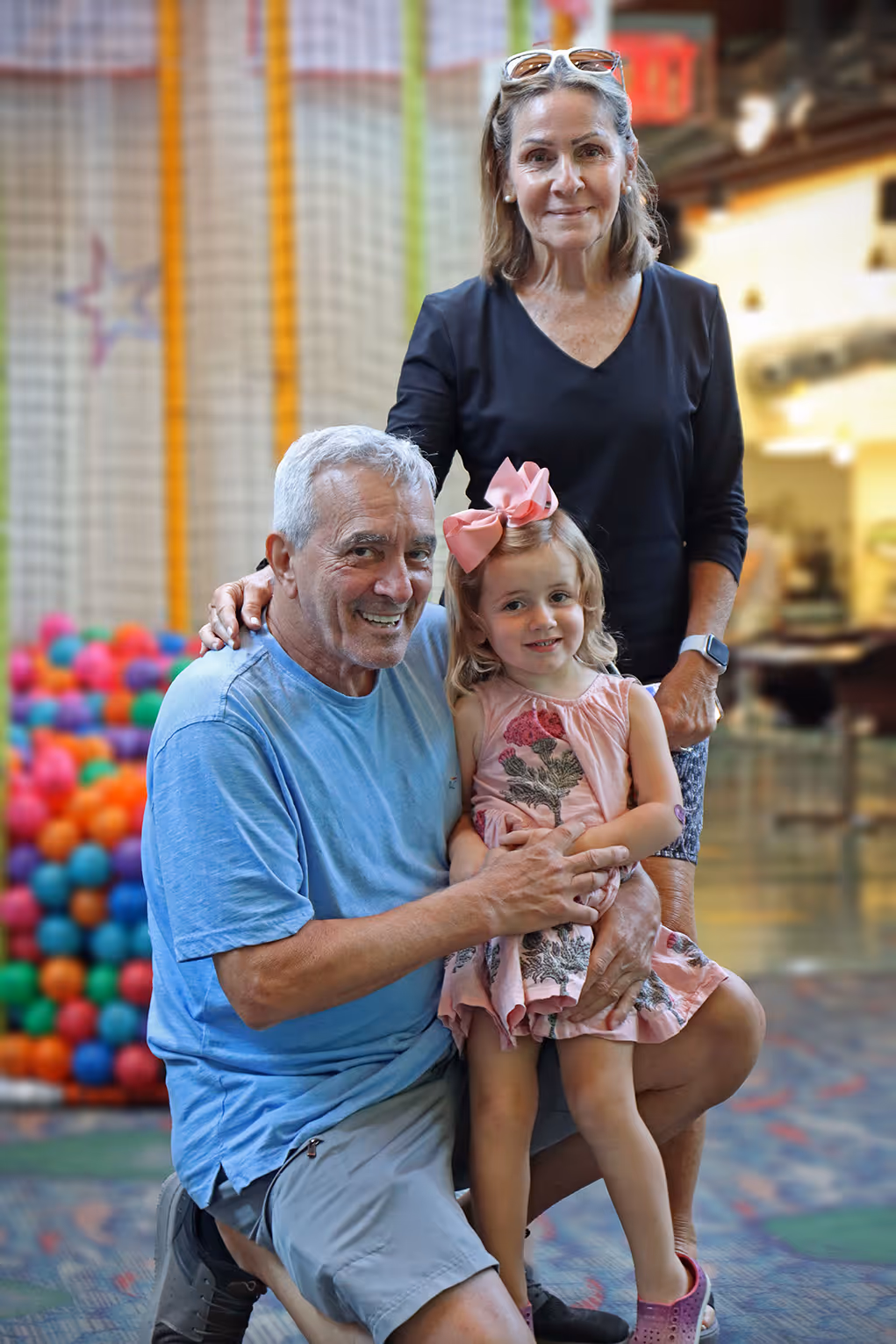 Grandparents spending time with their granddaughter at the Museum