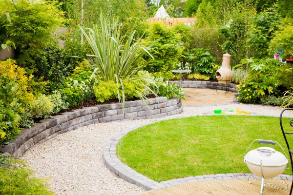 Lawn with stone pathways and patio.