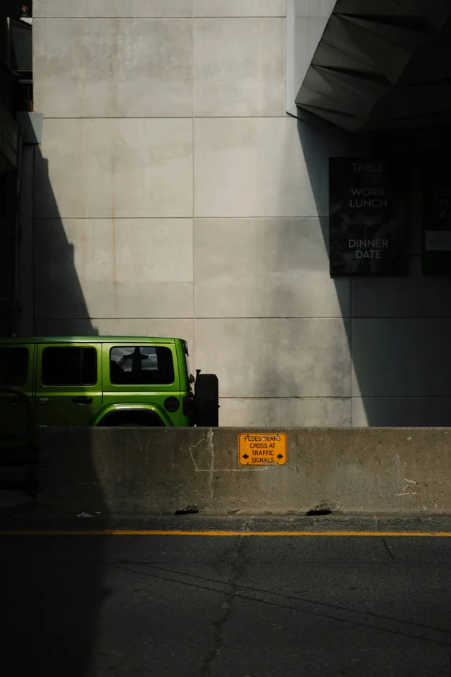 Green Jeep in hard light