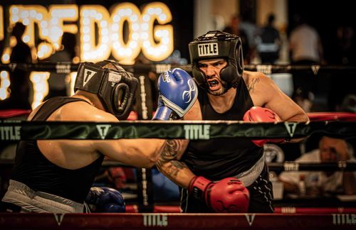 Omar at an amateur boxing event. He is shown boxing