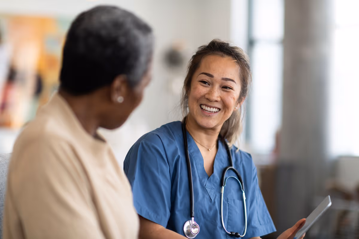 Medical professional discussing Medicare options with senior patient