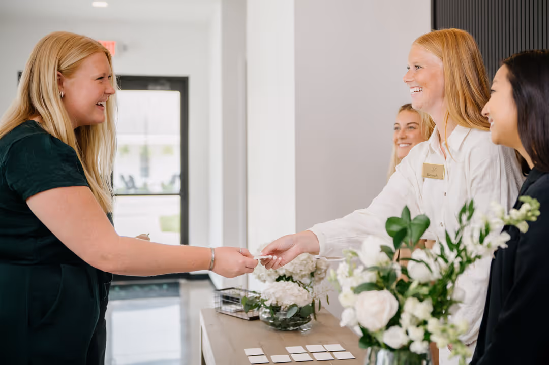 Event planning team assisting a client at Ivy House event venue in Saugatuck, Michigan