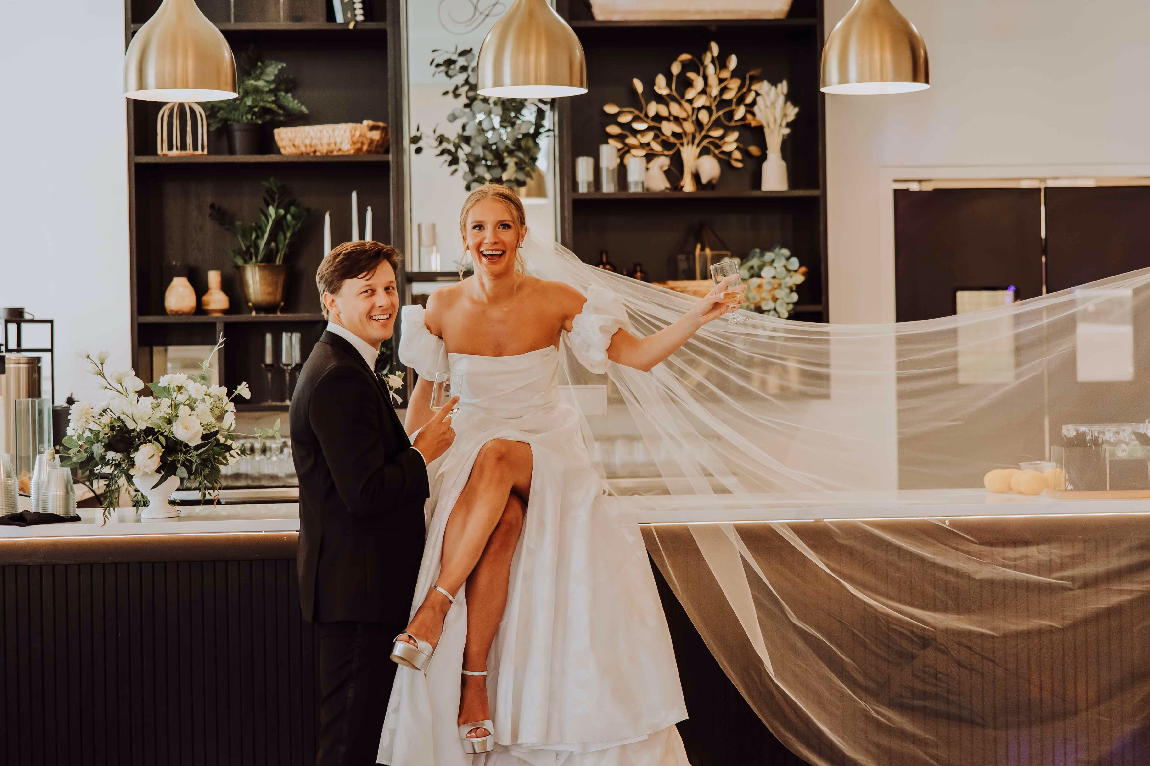 Couple celebrating at Ivy House all-inclusive wedding venue in Saugatuck, Michigan