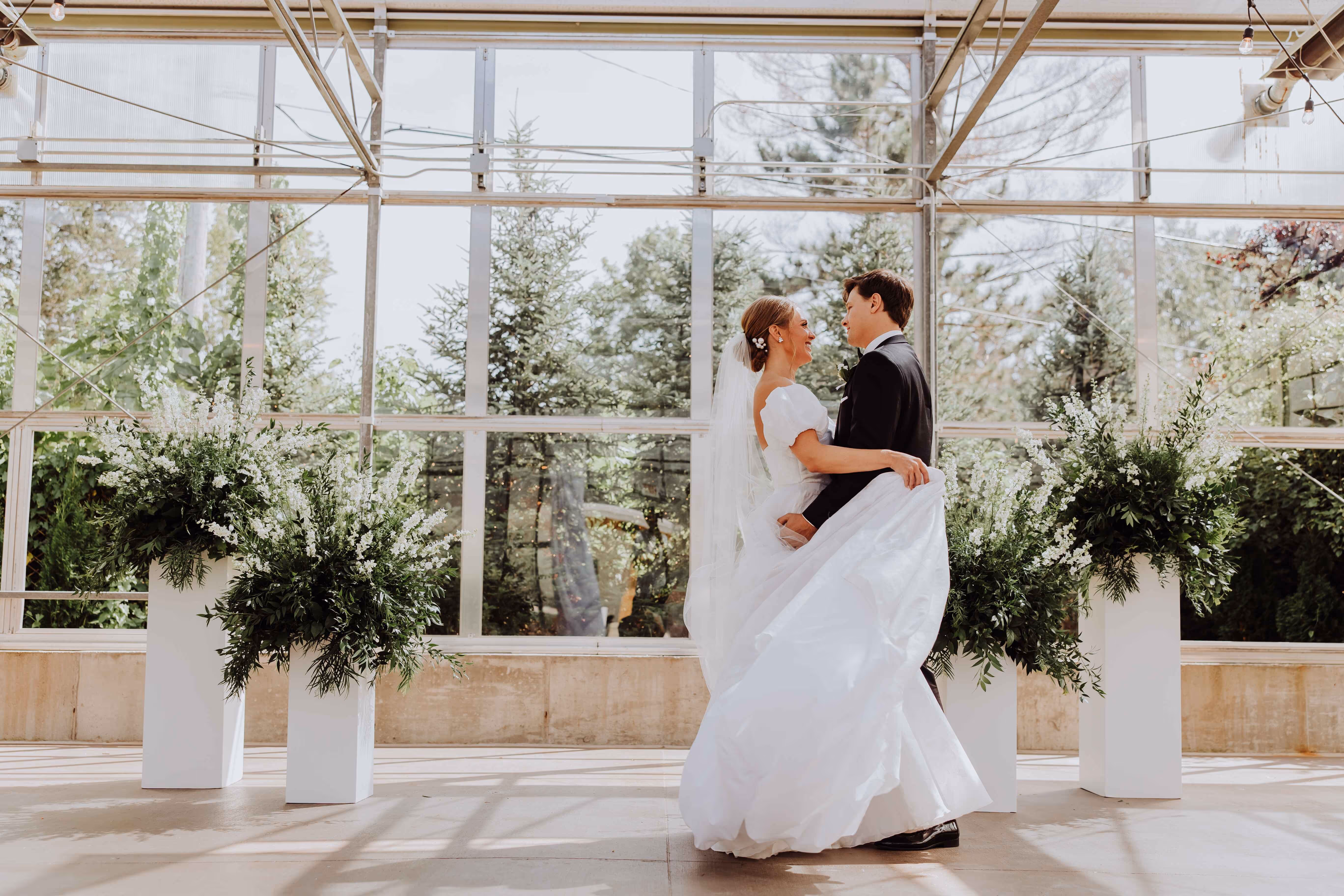 Indoor greenhouse wedding ceremony at Ivy House in Saugatuck, Michigan