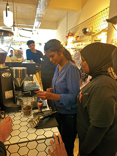 Livelihoods – A participant of the youth barista workshop learning how to brew a cup of coffee