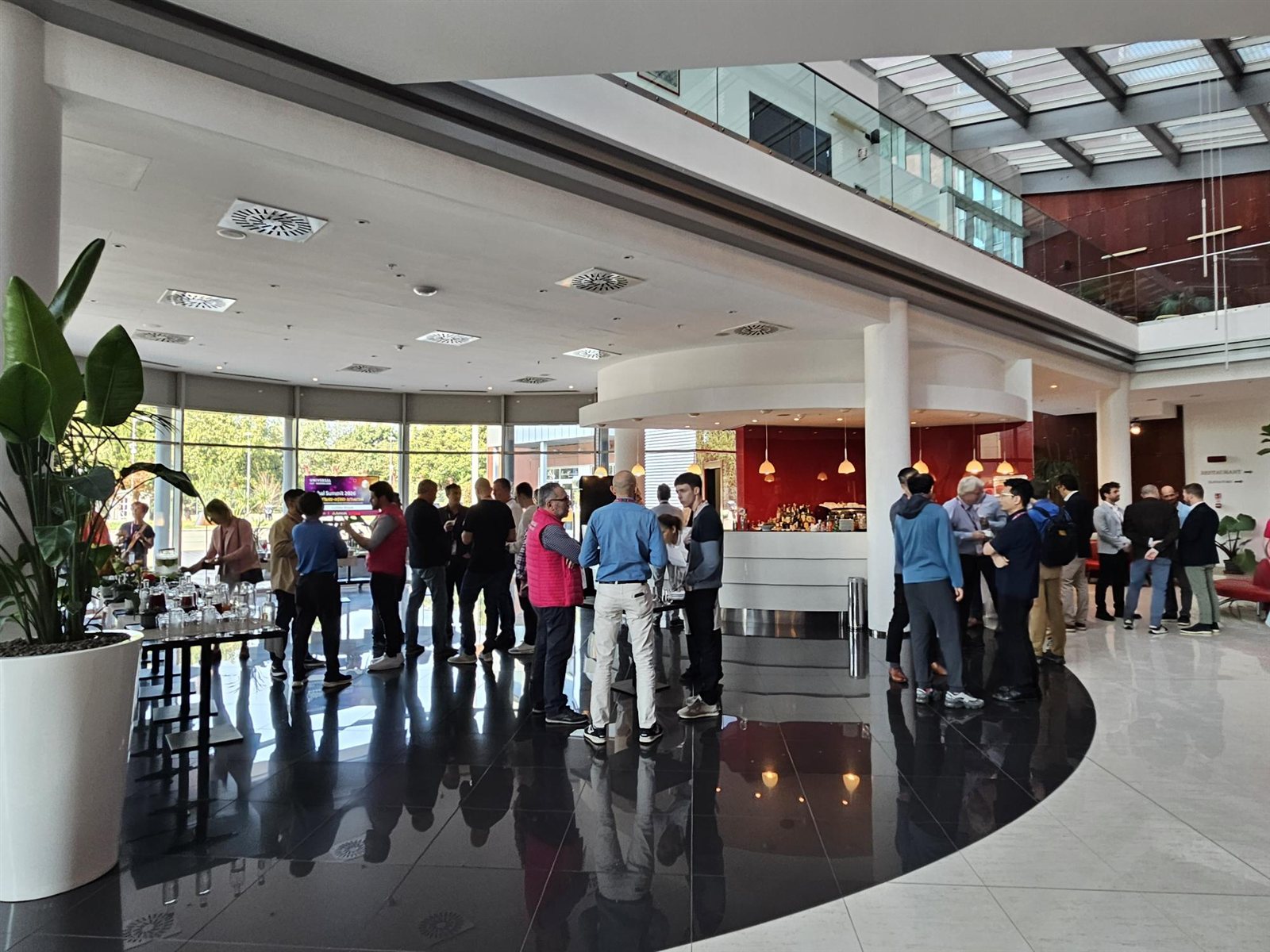 Attendees networking during a break at the UAO Global Summit 2026.