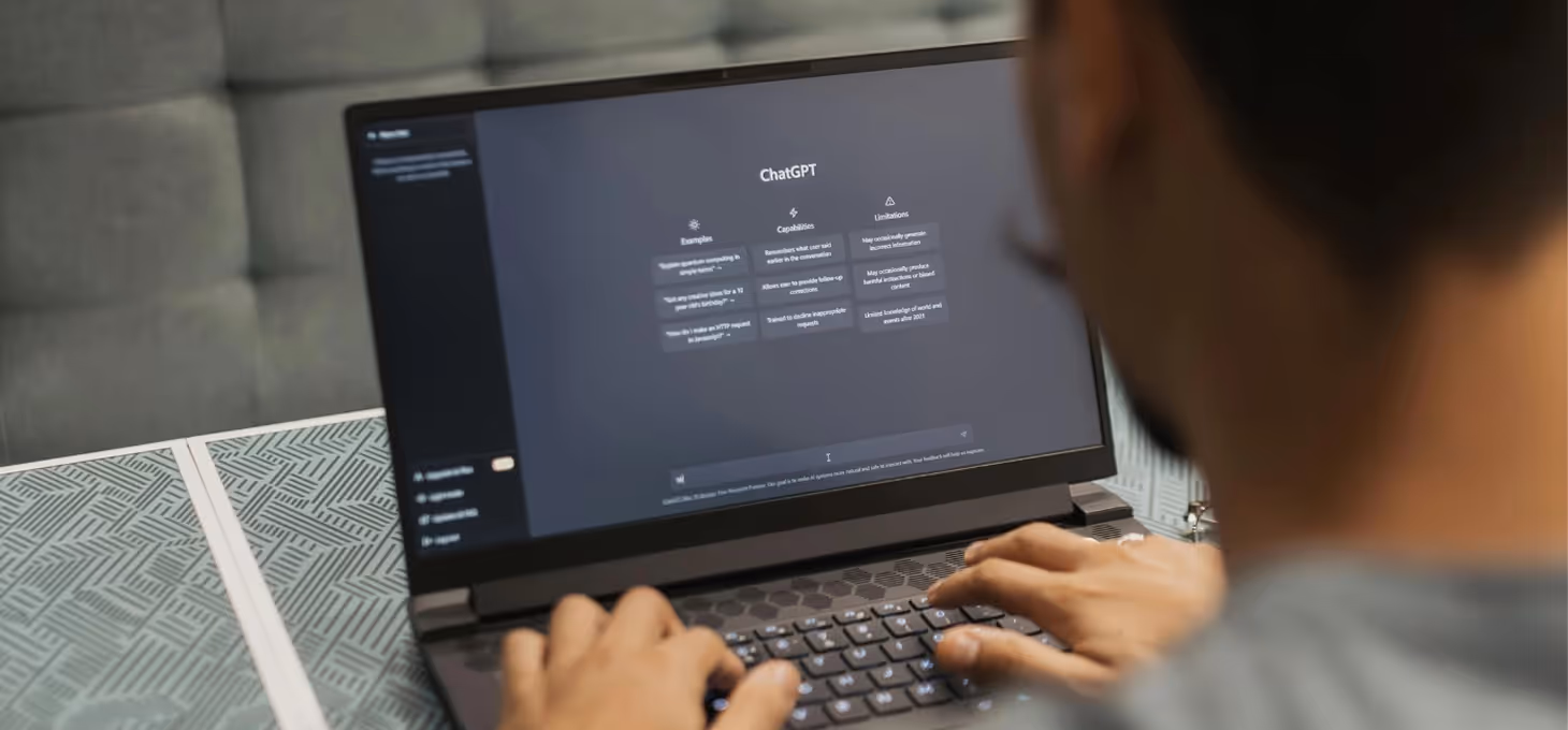 Person using ChatGPT on a laptop to generate content, illustrating AI-powered blog writing and SEO productivity tools.