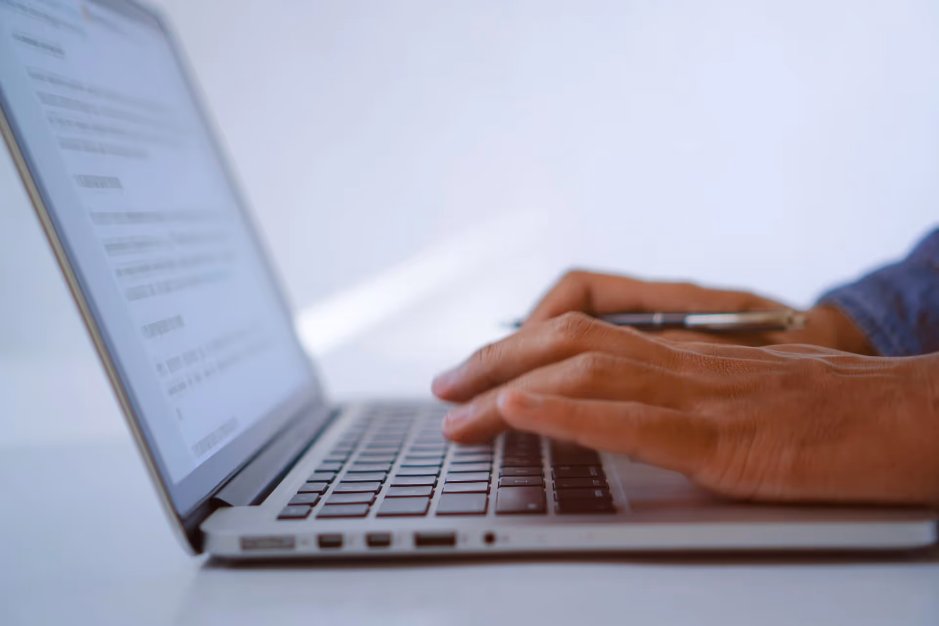 A person writing copy on a laptop