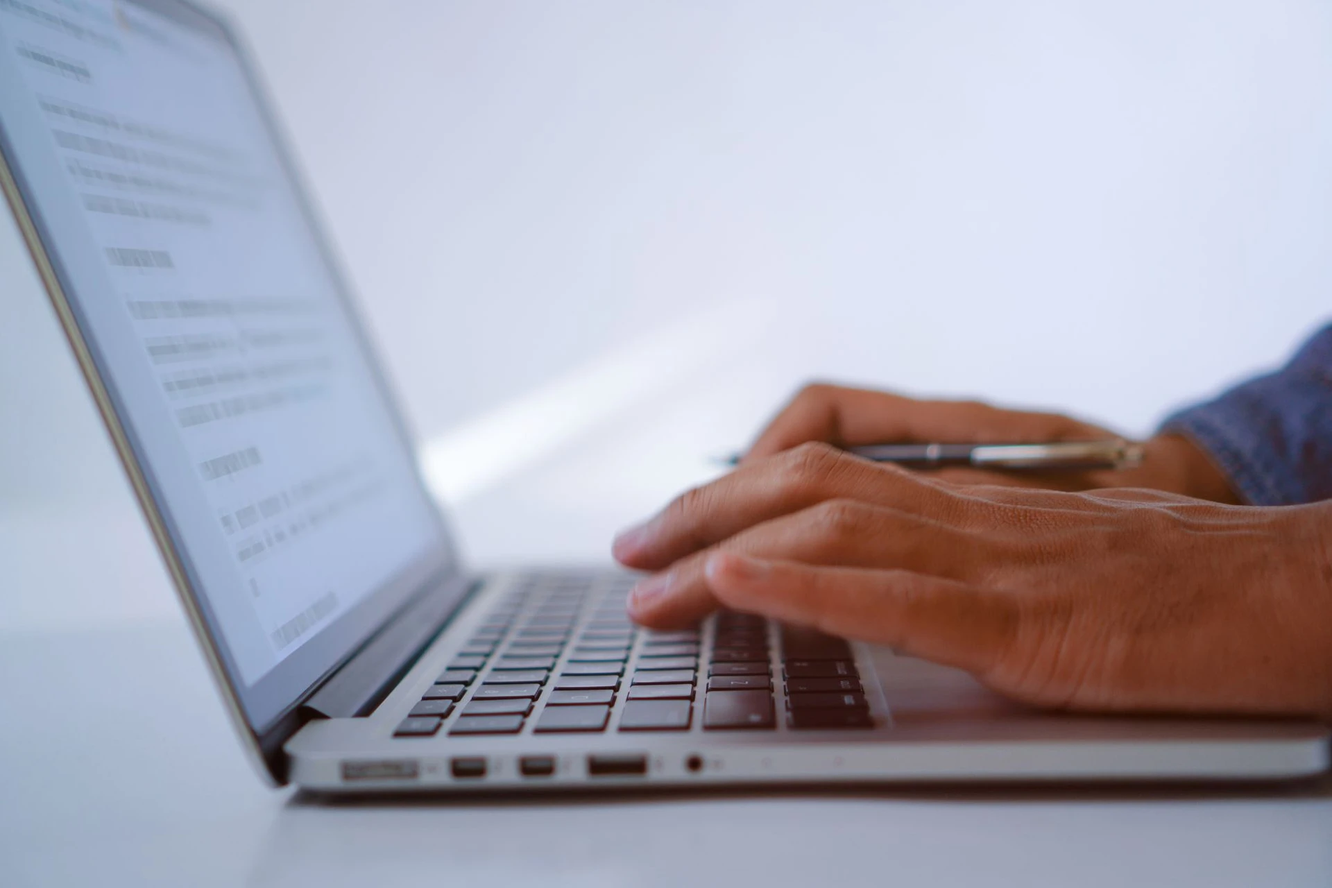 A person writing copy on a laptop