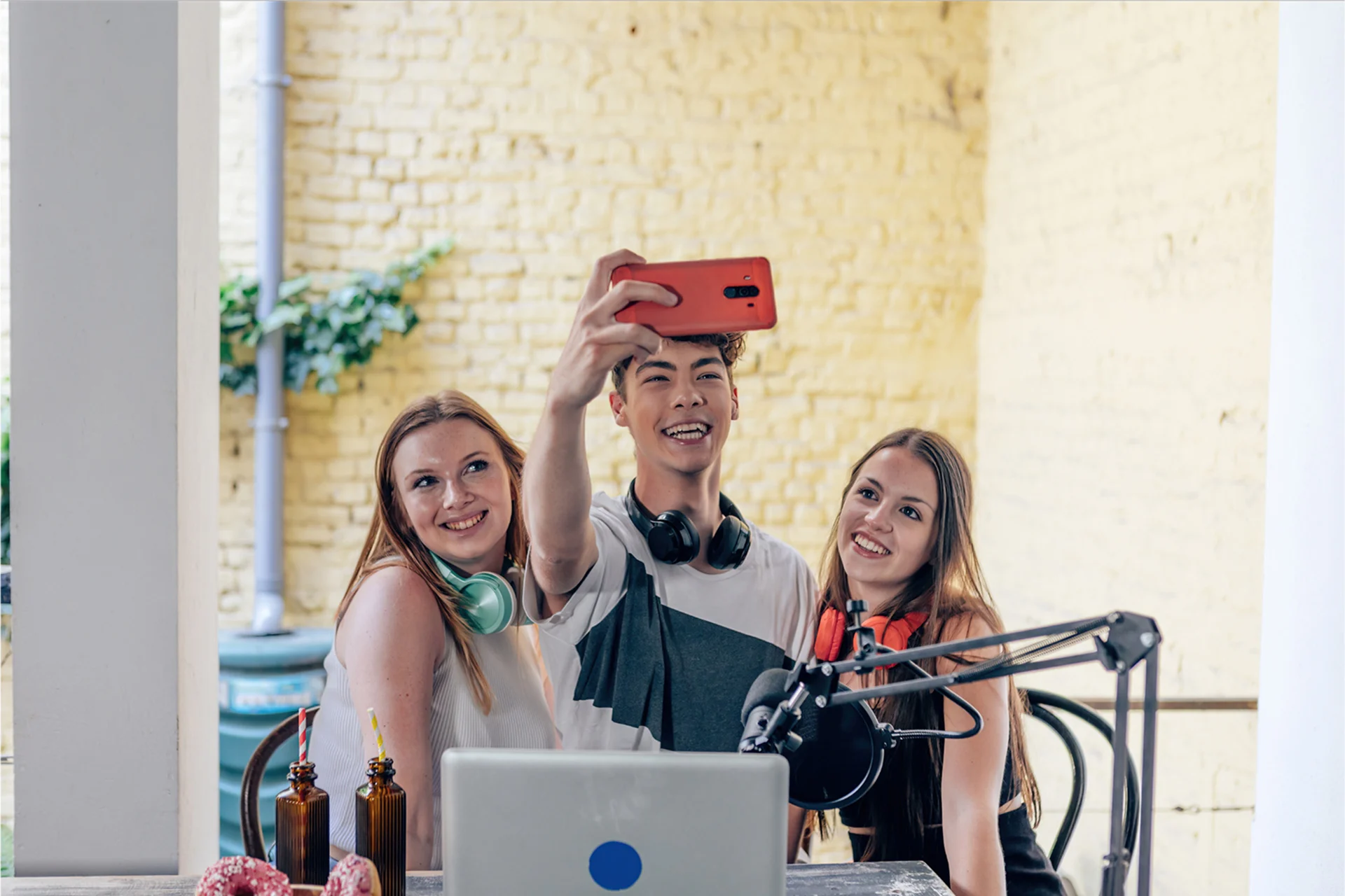 Student influencers taking a selfie while creating content