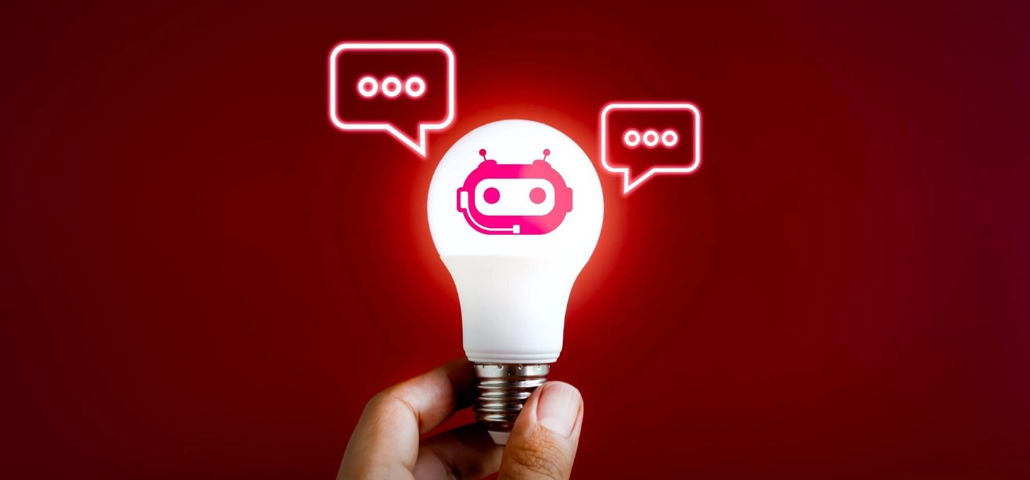 A glowing lightbulb features a robot head outlined in red at its center, illuminated brightly. On either side, two chat boxes hover, completing the scene.