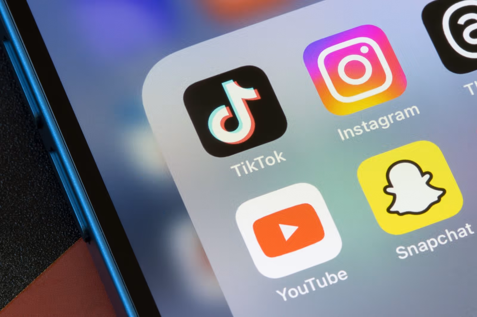 A bunch of social media icons on a phone.