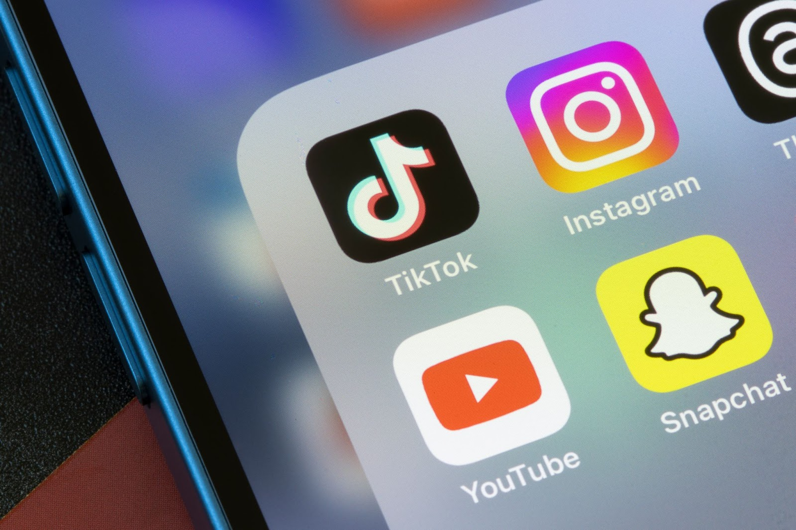 A bunch of social media icons on a phone.
