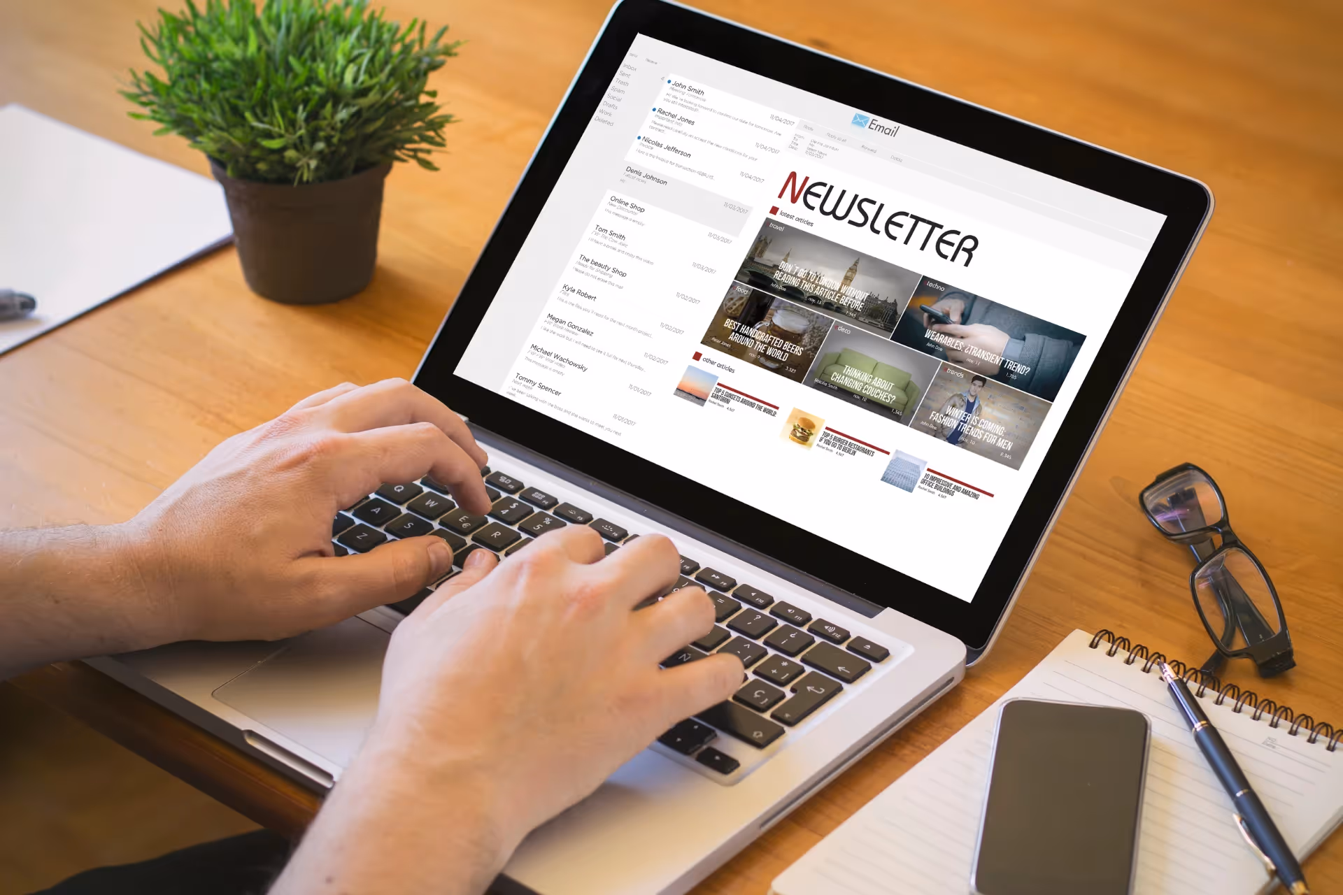 A person reading a newsletter on a laptop