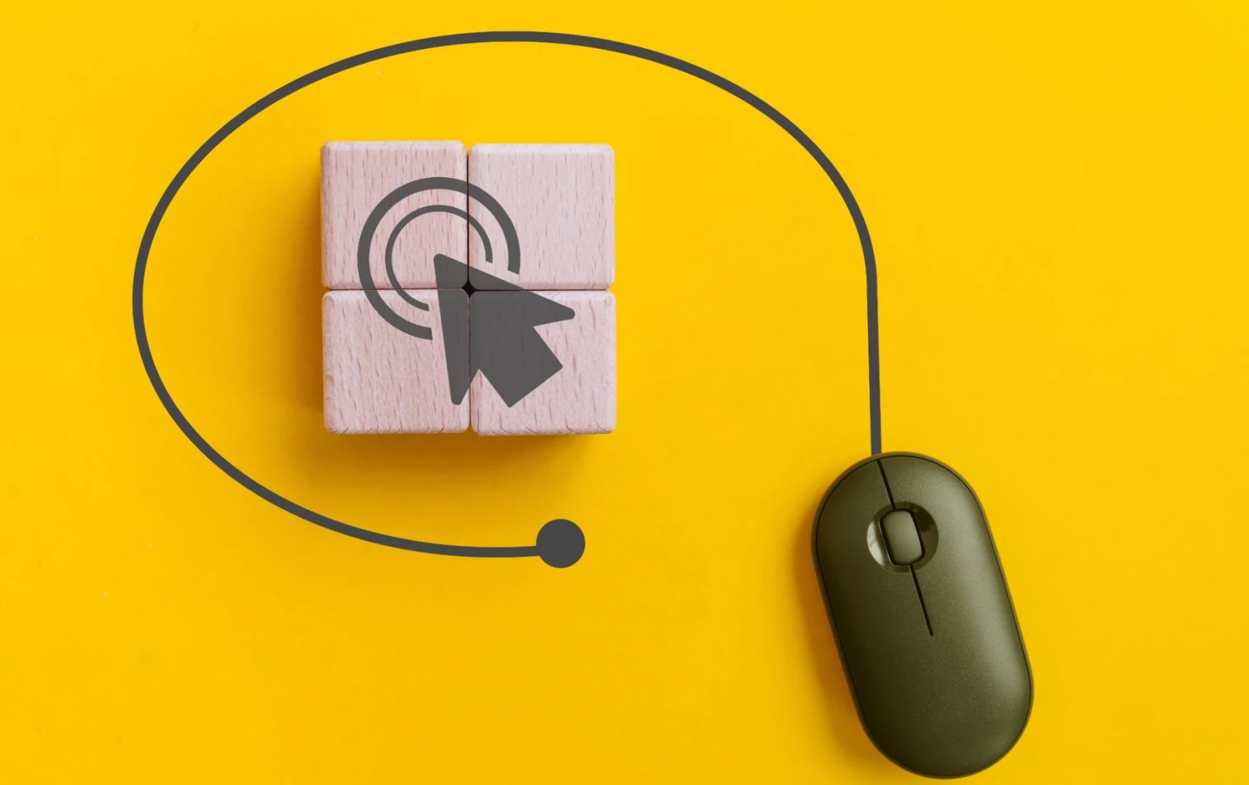A black mouse on a yellow background with four wooden blocks with an image of an arrow on them.