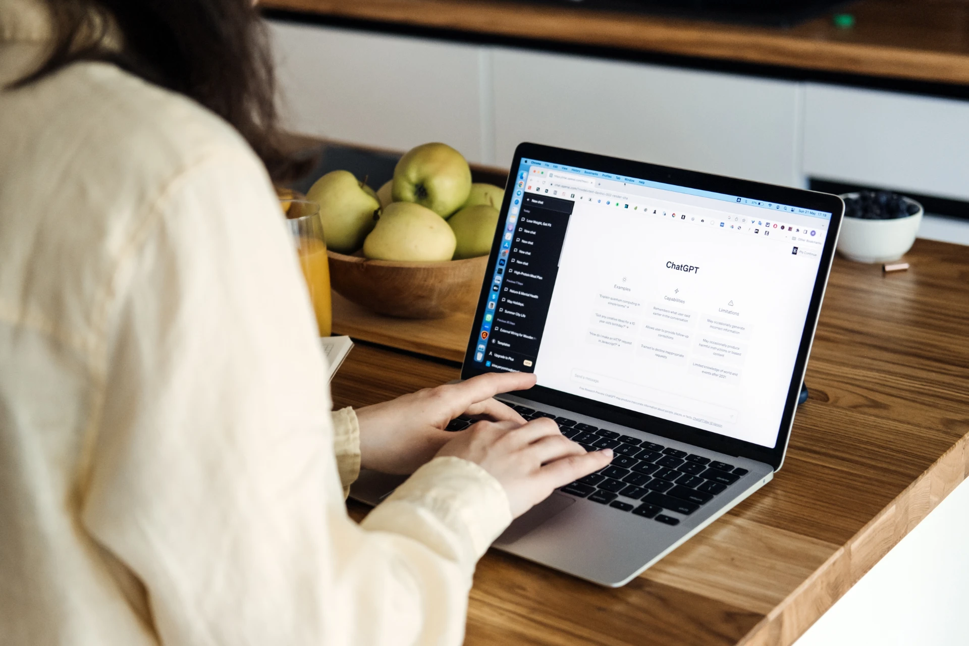 A woman using ChatGPT to prompt.