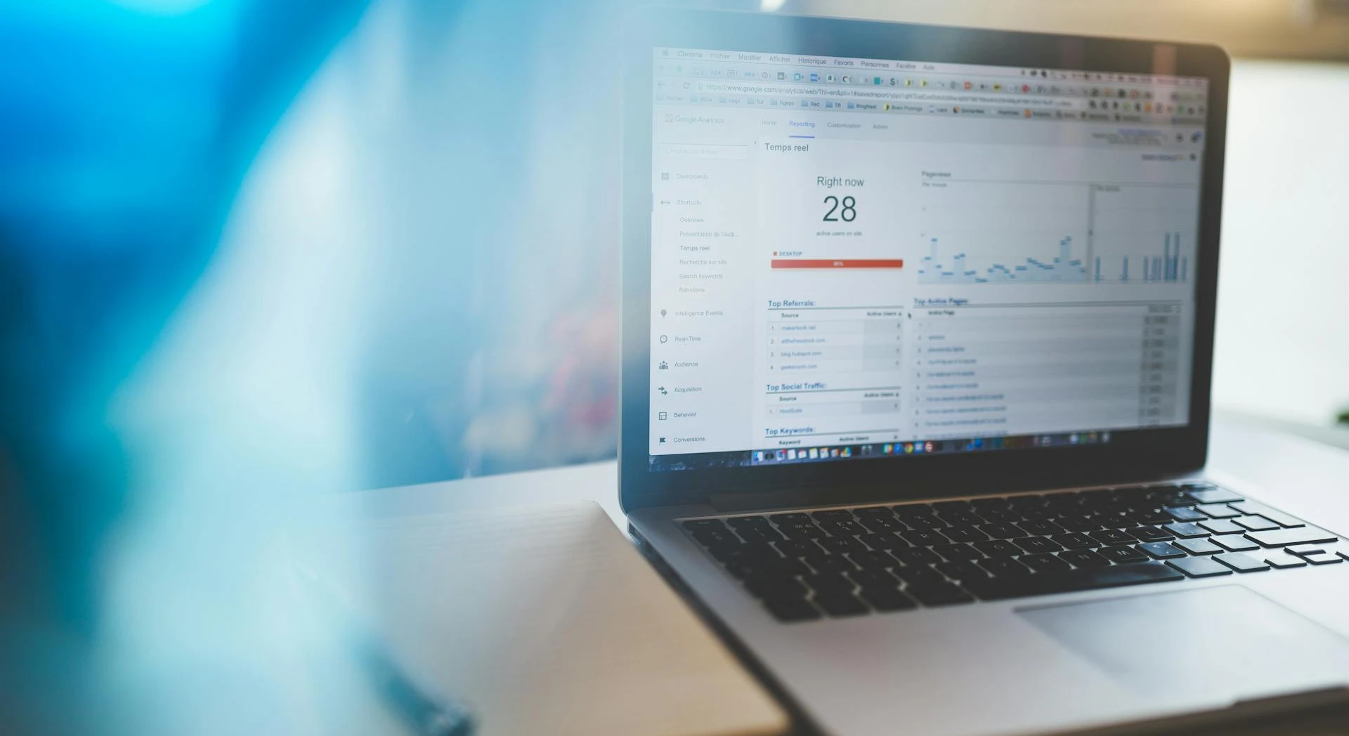 Laptop displaying website analytics in a modern workspace