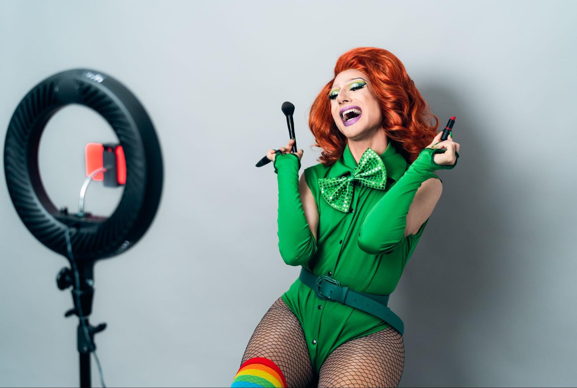 An LGBTQ influencer in drag filming content