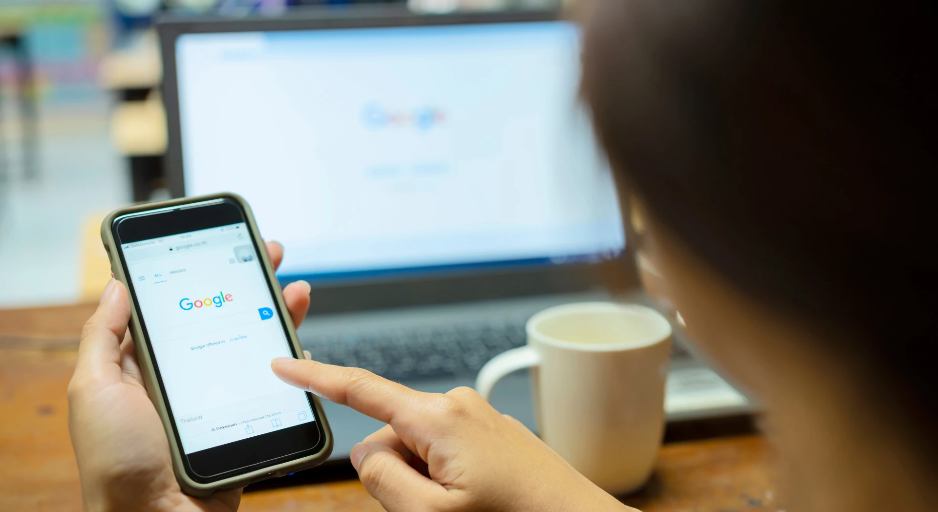 A woman about to search on Google on her phone