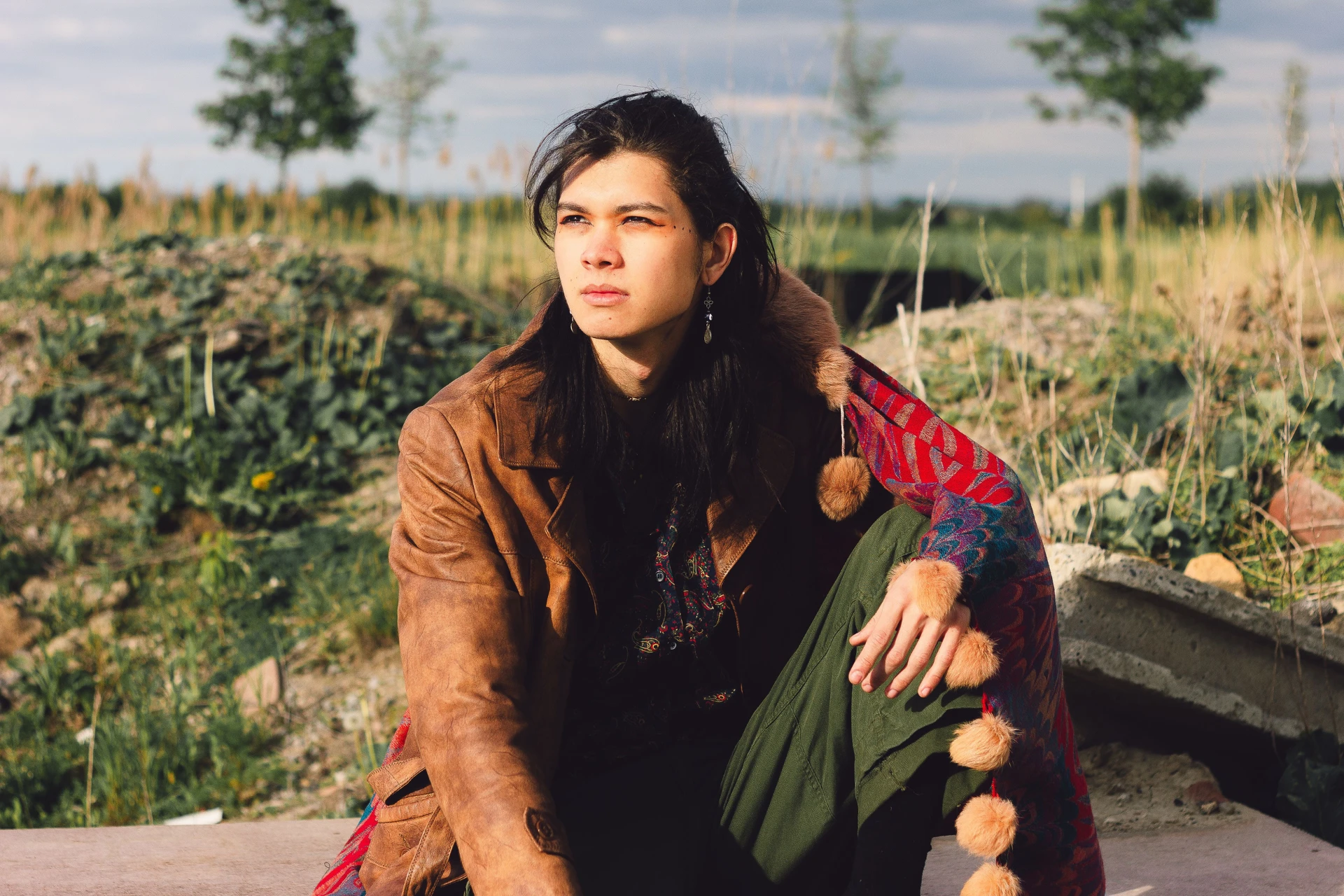 Indigenous influencer sitting outdoors