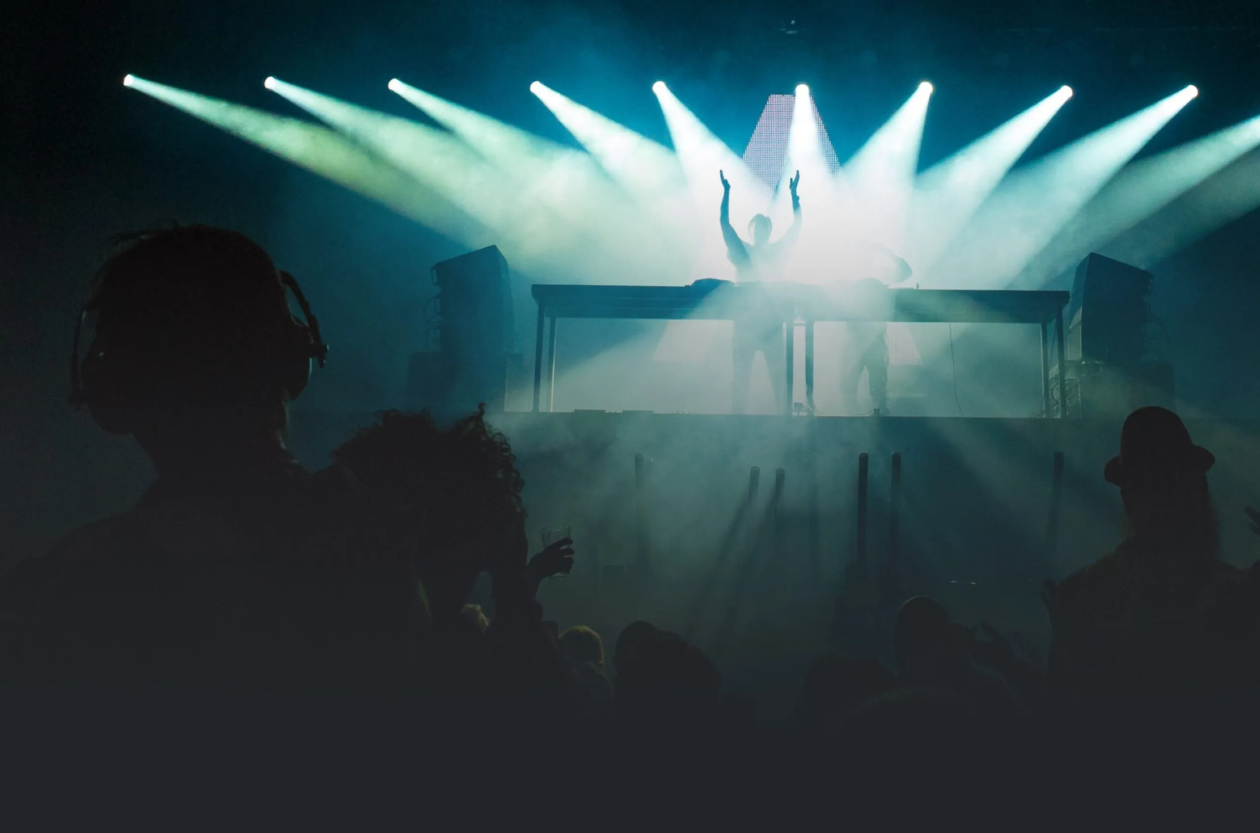 A DJ in front of a live crowd