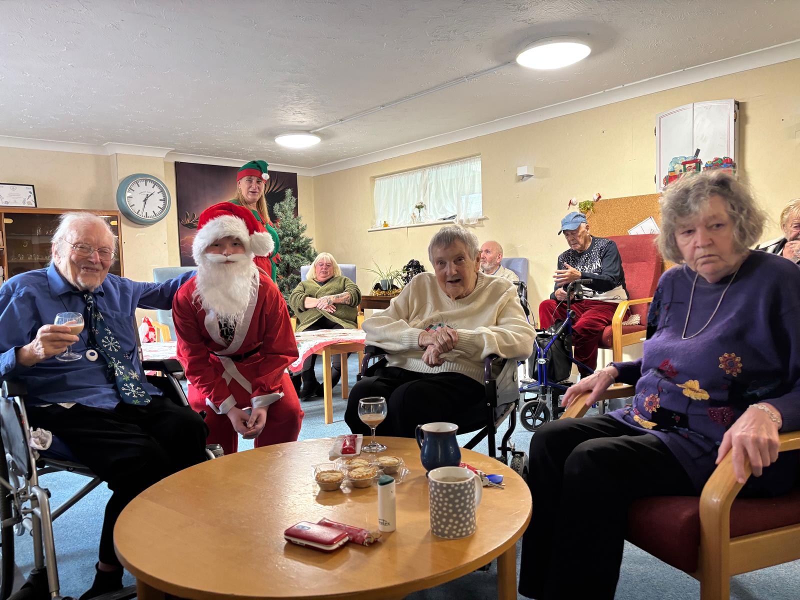 Image shows young Santa Jake Huntingford spread Christmas joy at Kate Daniels House Dec 2025 TDC