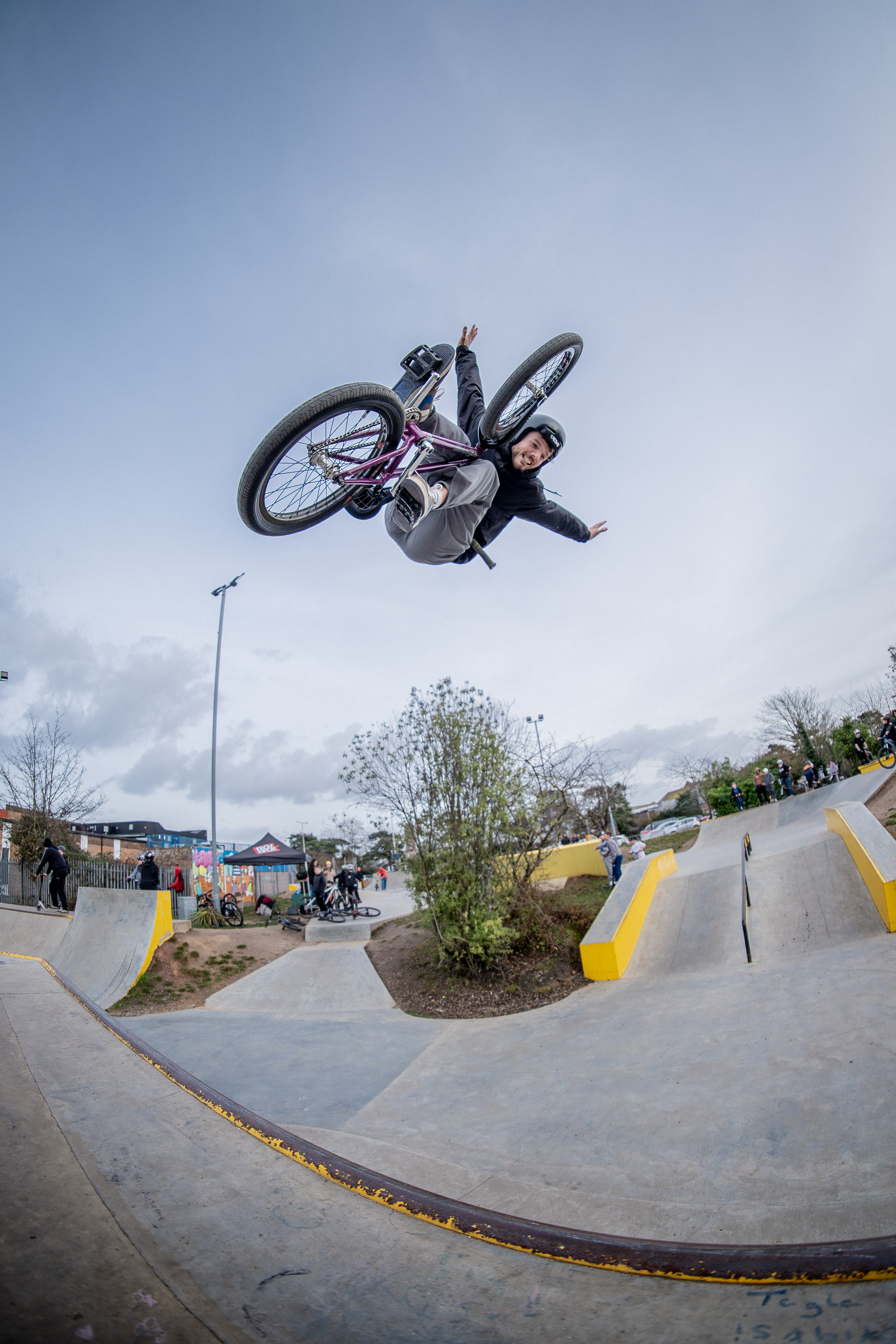A man on a BMX performs a high jump trick at Clacton Trax skatepark