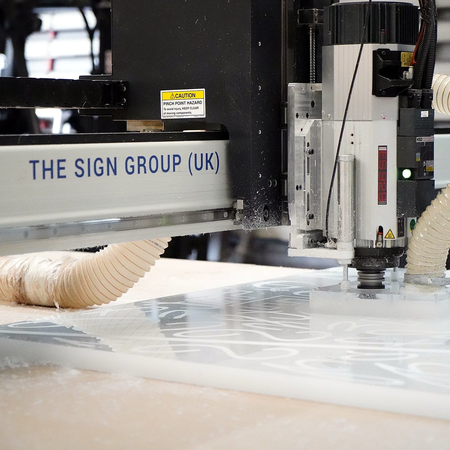 The Sign Group CNC router cutting acrylic