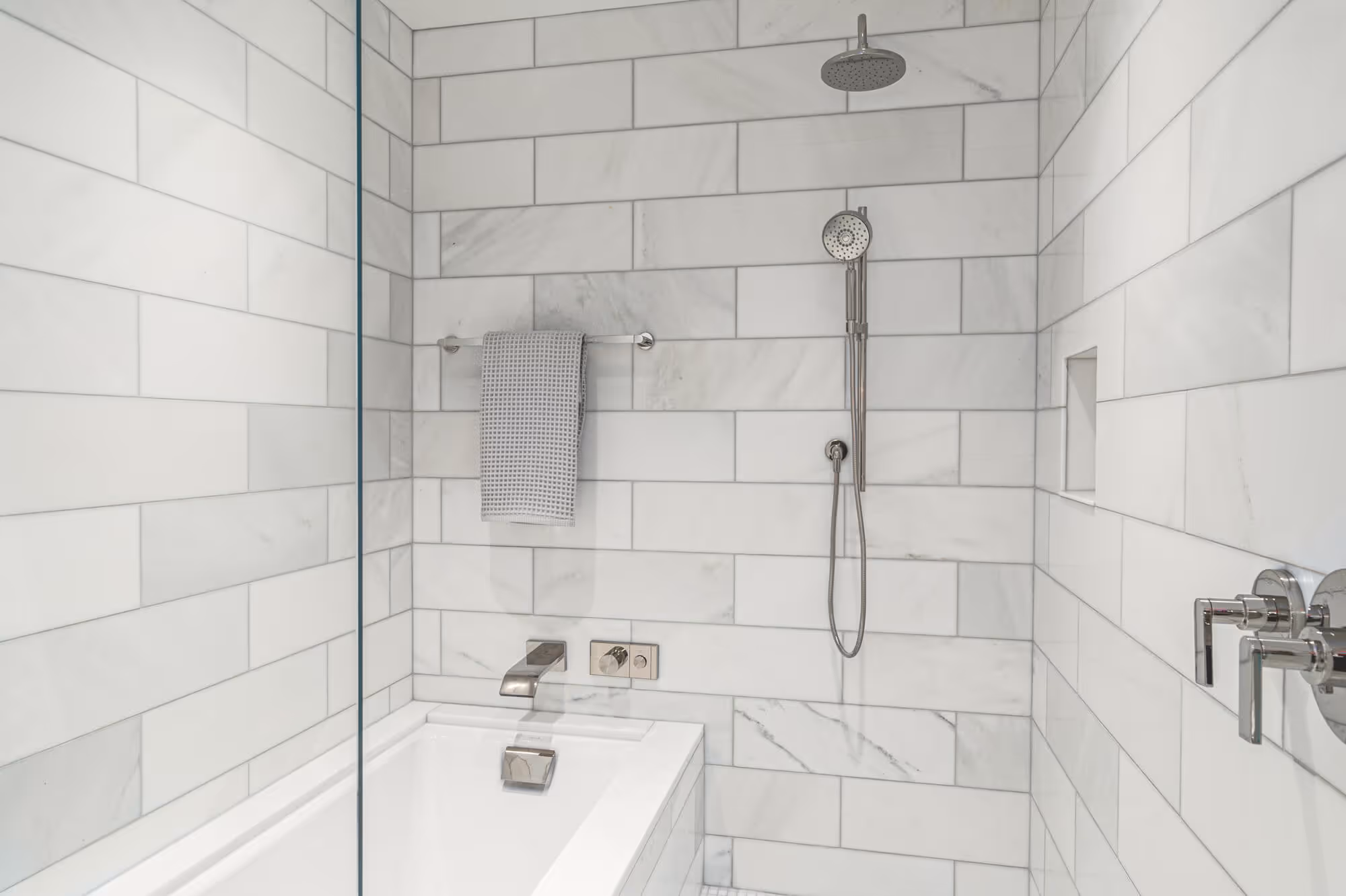 Marble shower in a Residence bathroom