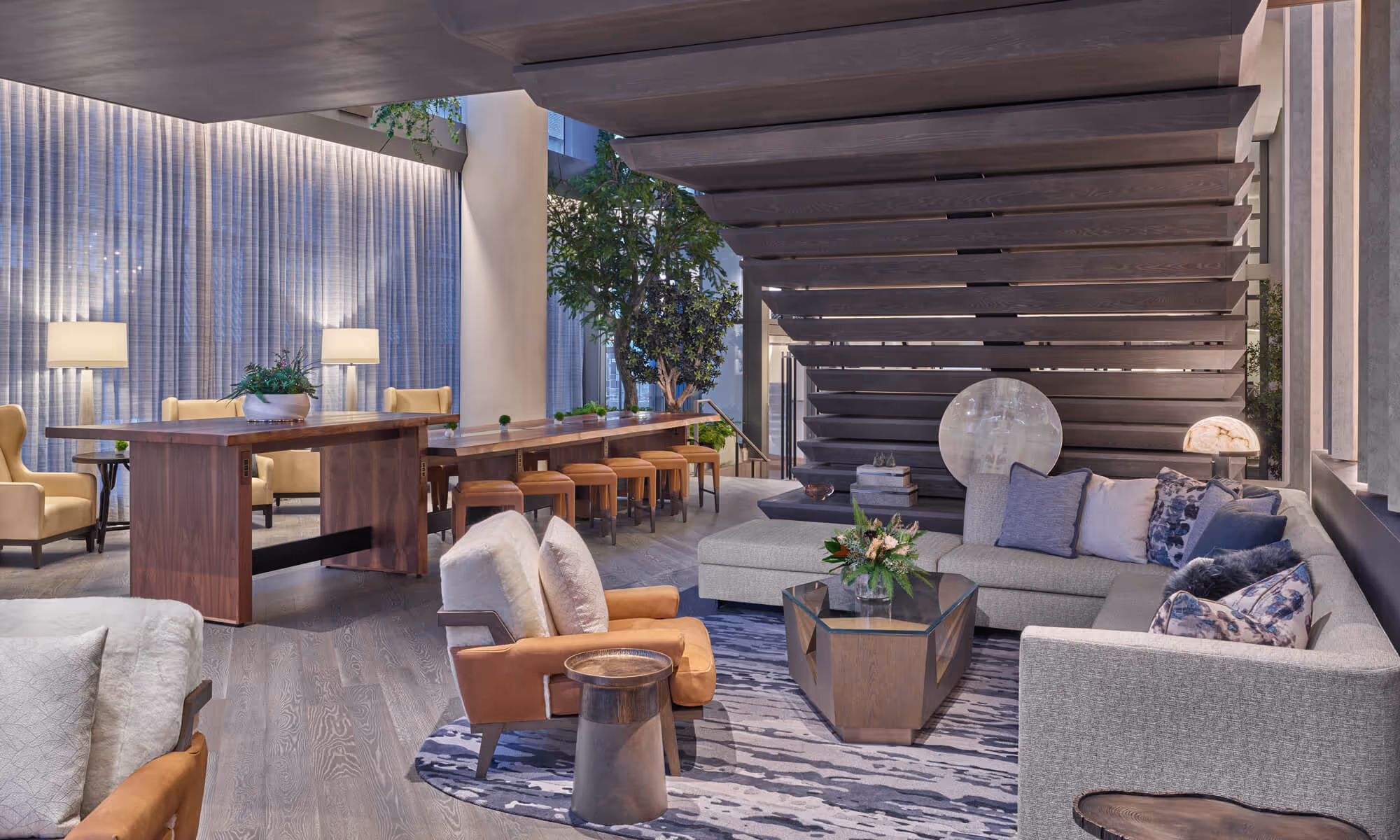Lounge seating under the Grand Staircase in the lobby of The Ritz-Carlton Residences, Portland