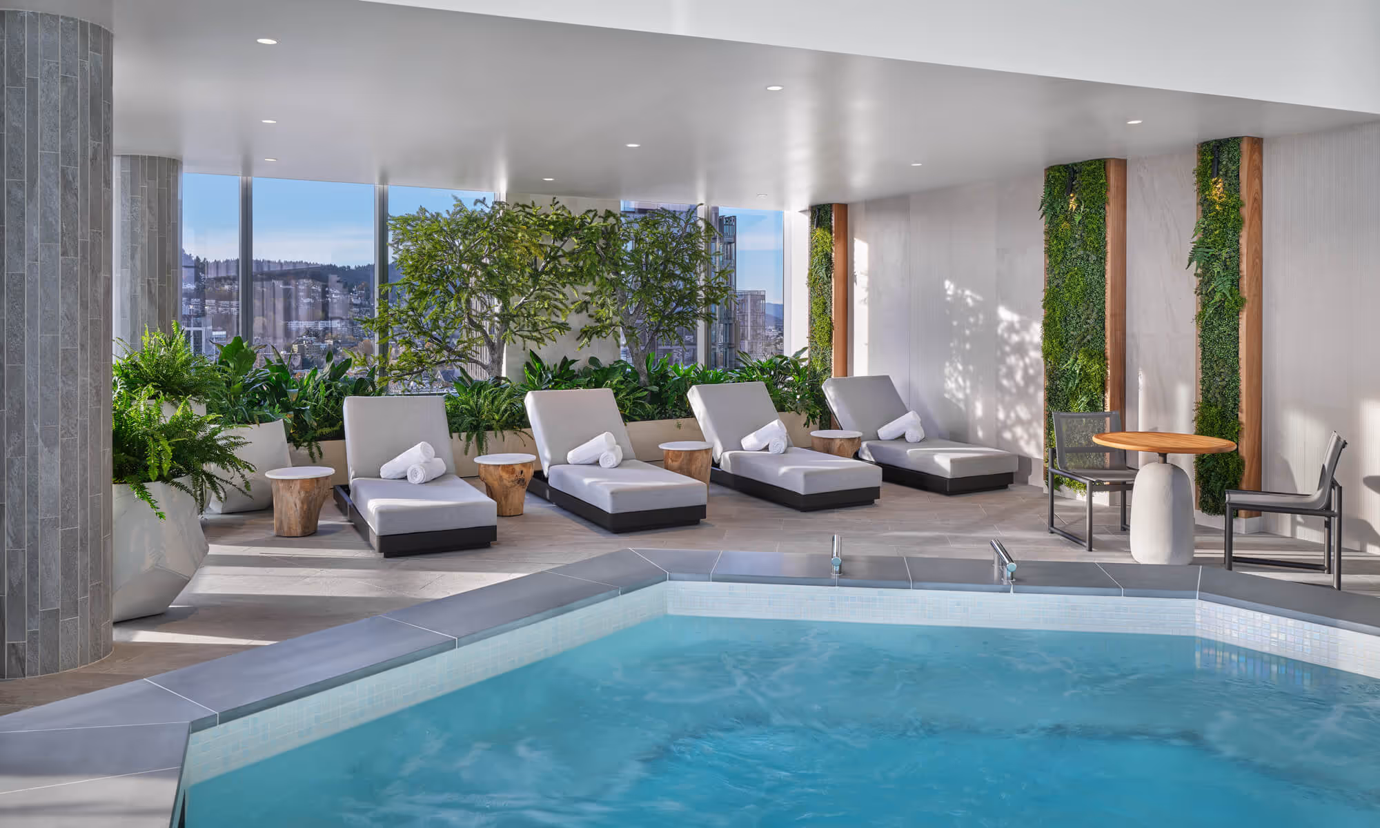 Lounge chairs along the Hidden Mountain Lake Infinity Pool & Jacuzzi