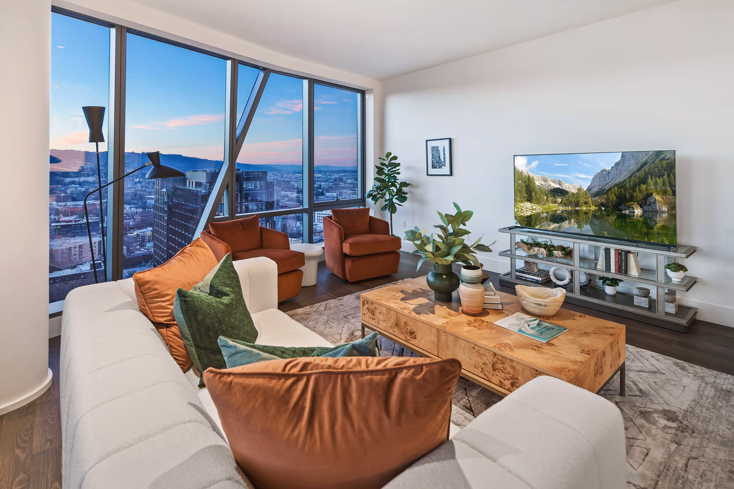 Sunset paints the sky pink through the windows of a Residence living area