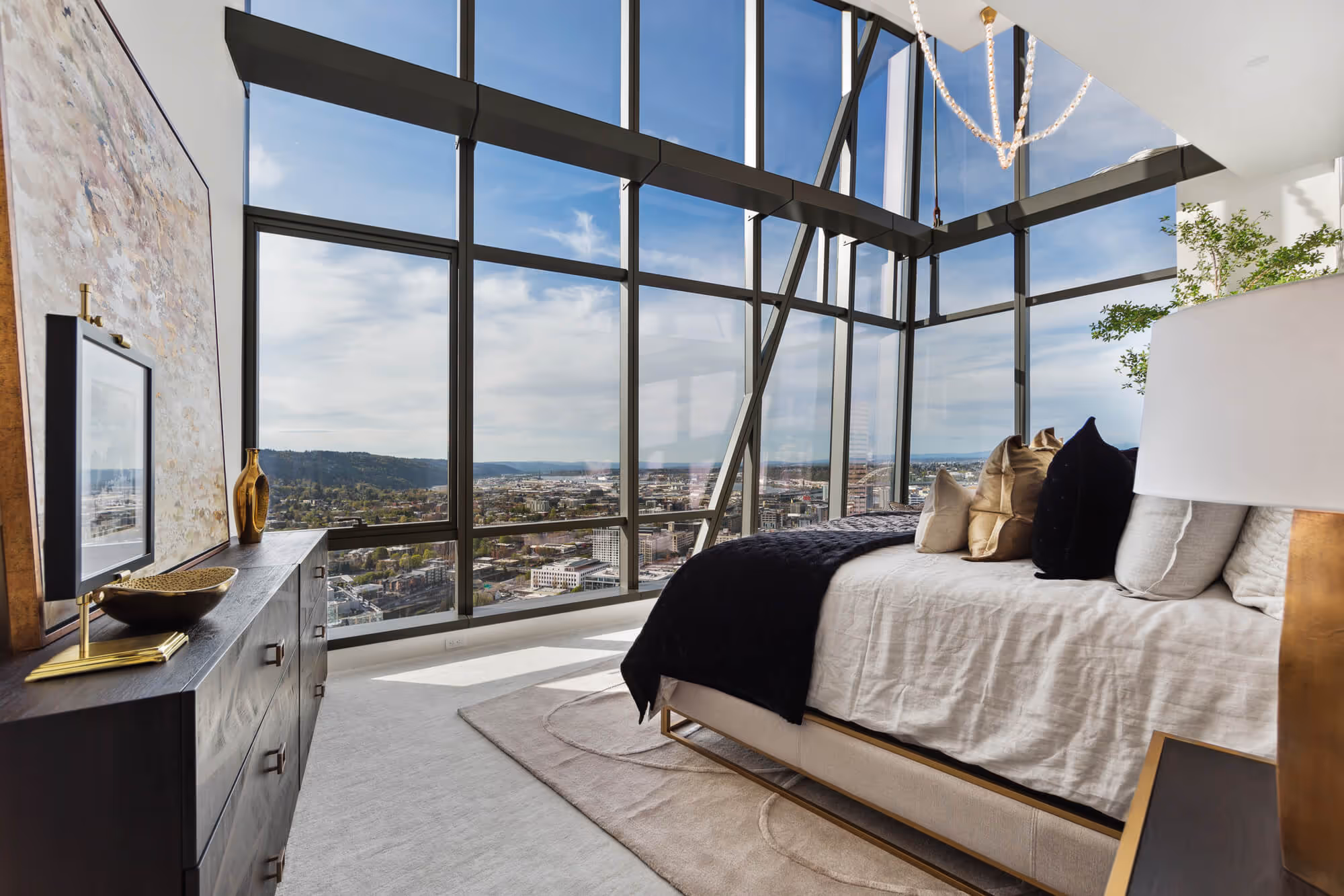 Primary bedroom of a Penthouse with floor-to-ceiling window walls