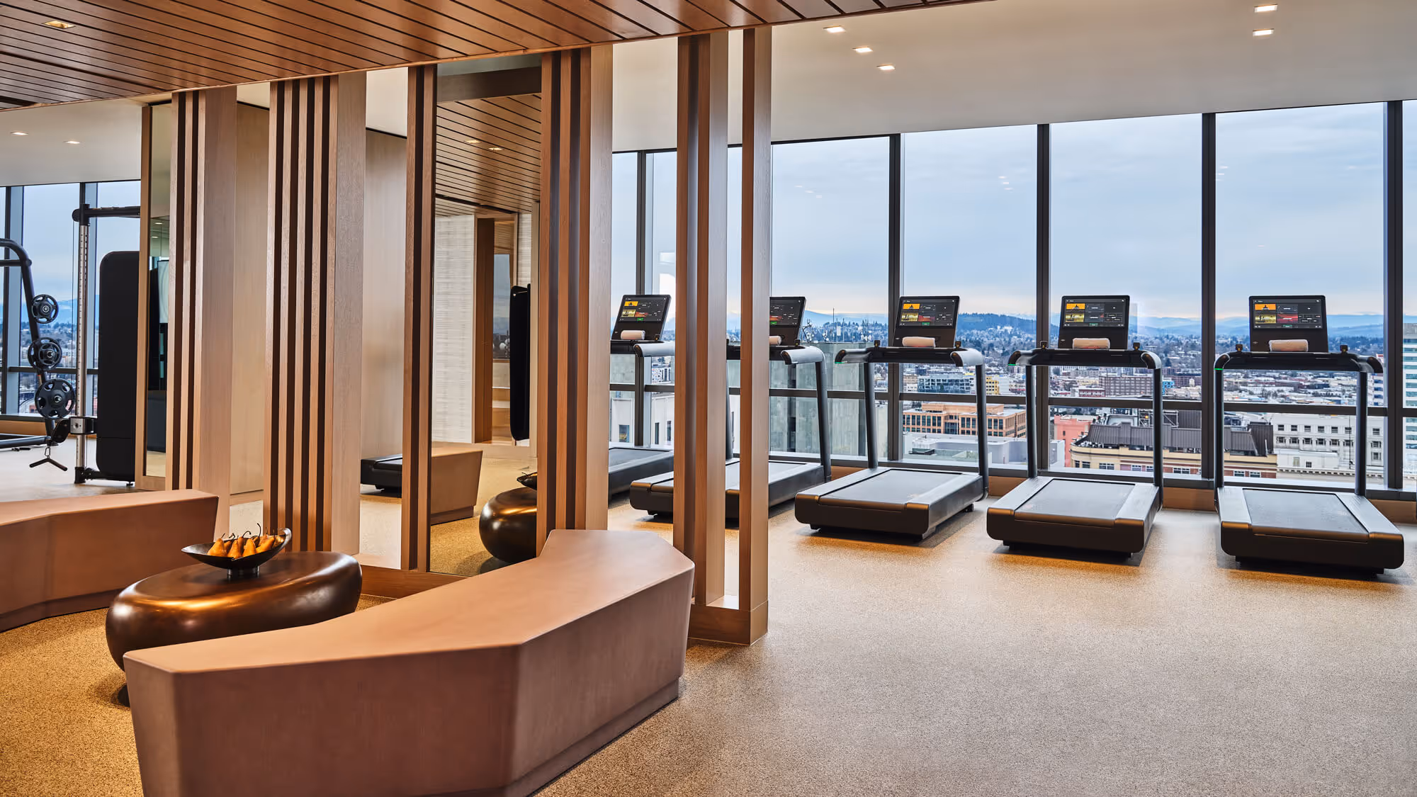 Treadmills overlook the city skyline in the state-of-the-art Fitness Facility at The Ritz-Carlton Residences, Portland