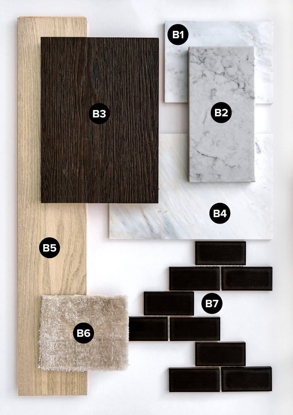 Collection of labeled interior finish samples including light hardwood flooring, dark cabinet wood, white and grey quartzite and marble tiles, a beige carpet swatch, and dark rectangular tiles on a white background.